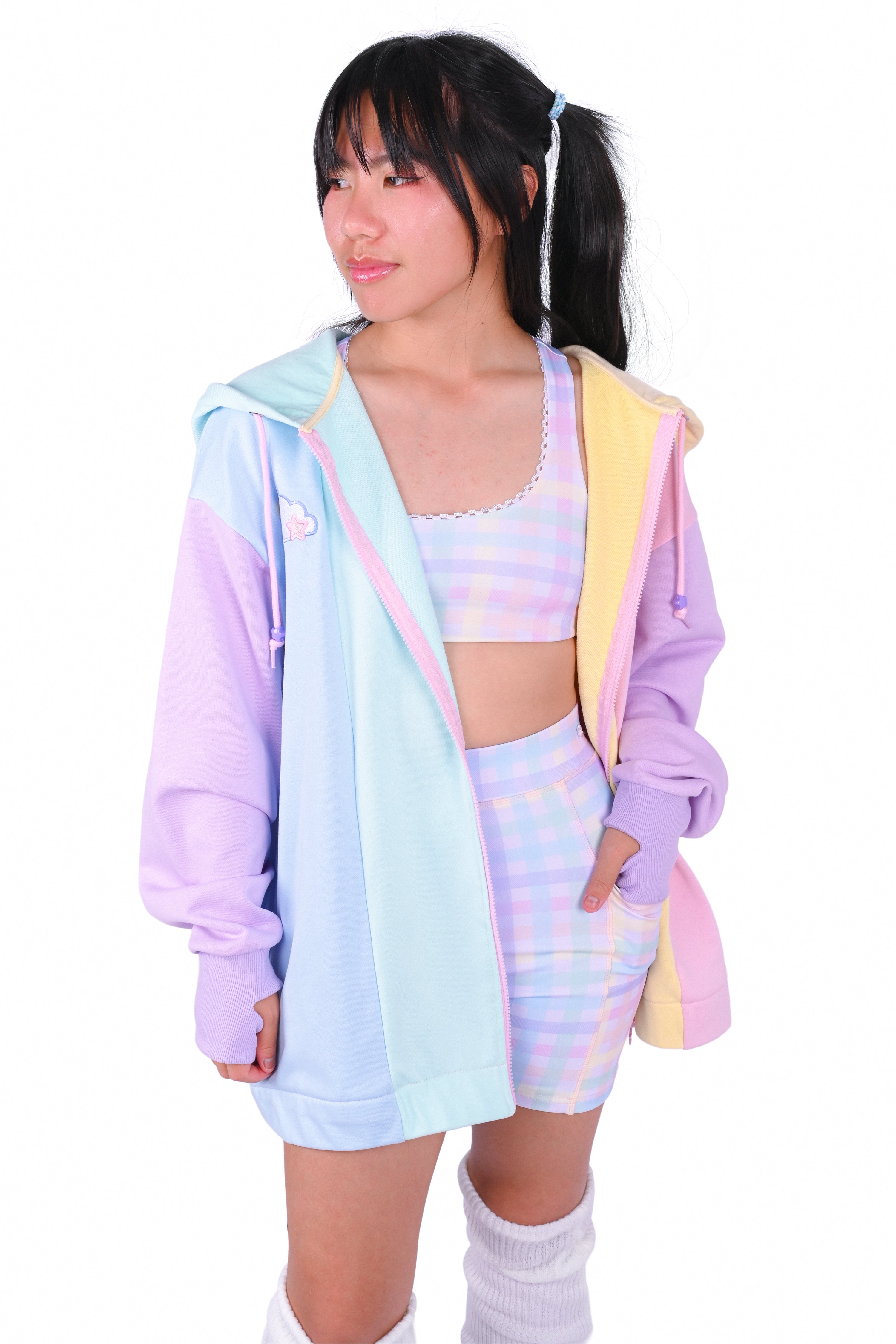 Person wearing a rainbow pastel colored blocked hoodie