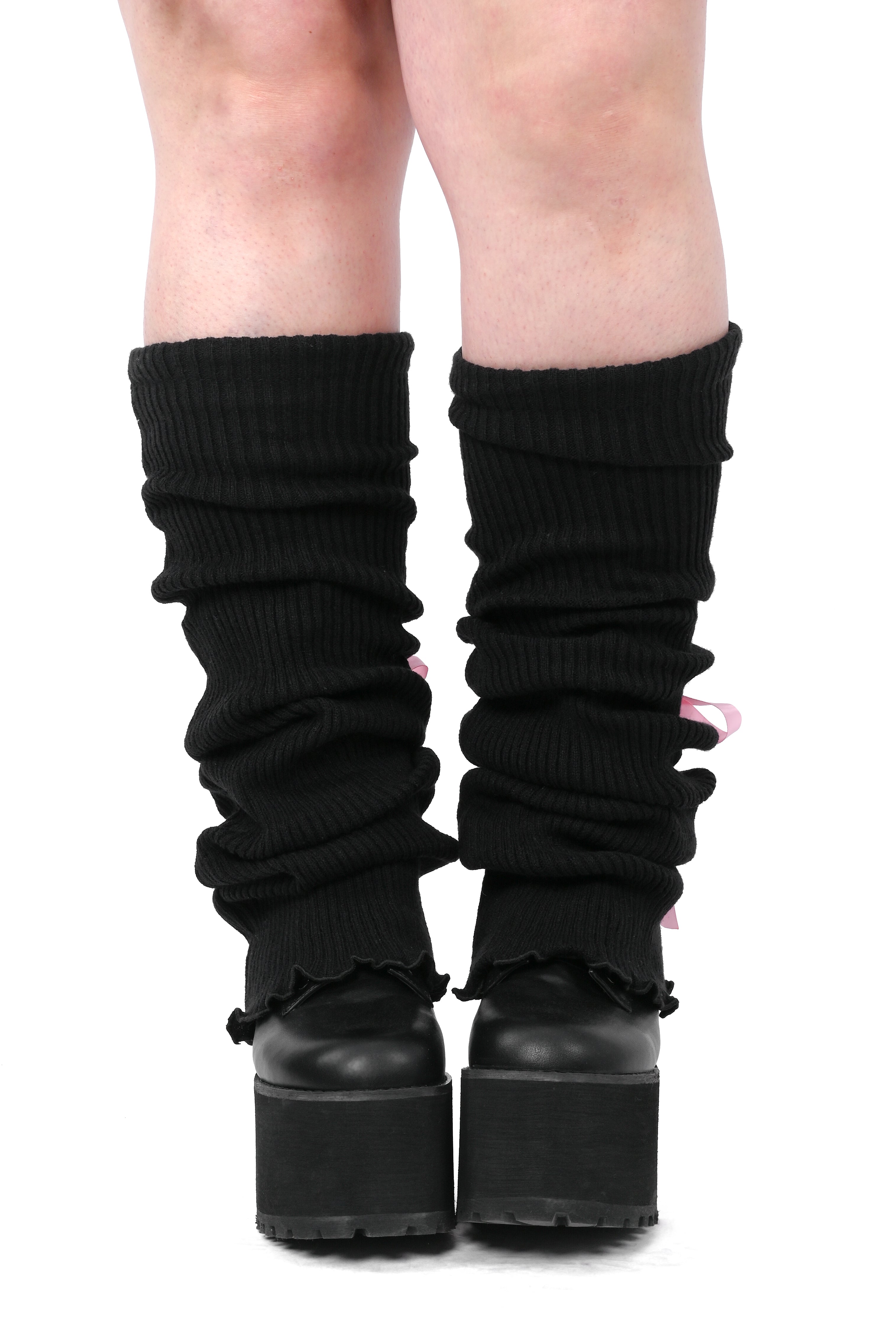 A pair of black legwarmers with pink laces