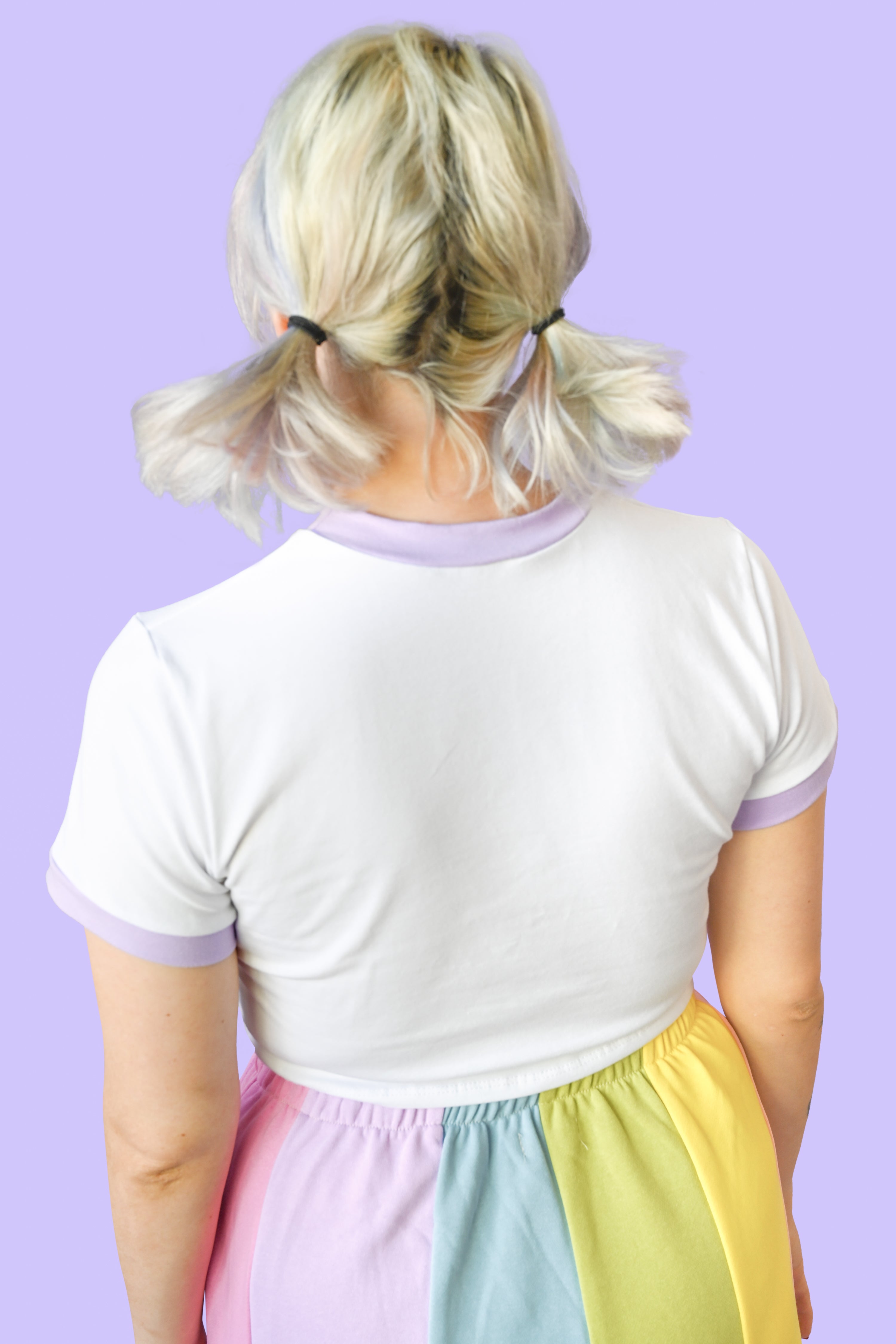 Cropped white tee with a pop of lavender on the sleeve and collar