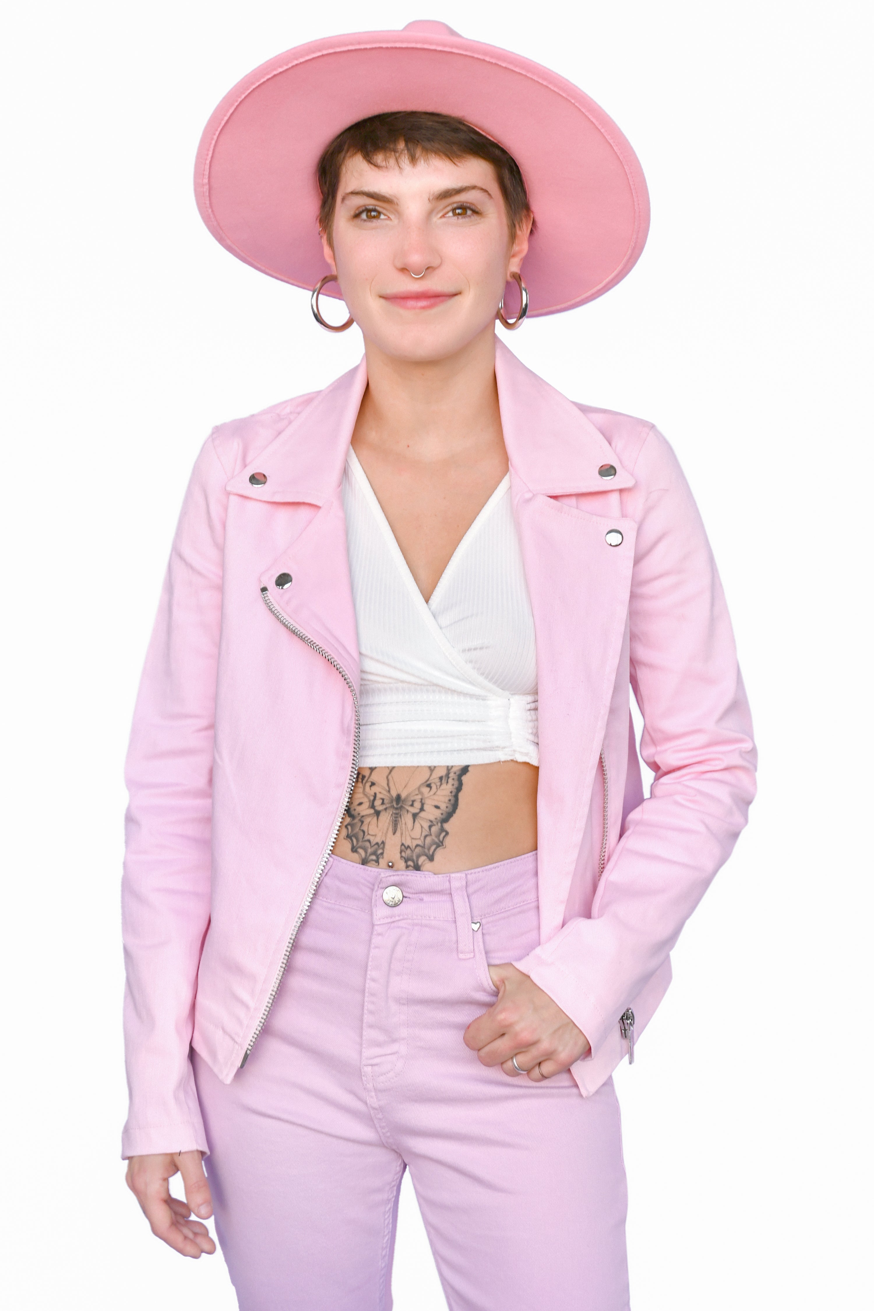 A slightly oversized stretch pink denim motorcycle jacket just begging for all your pins and patches