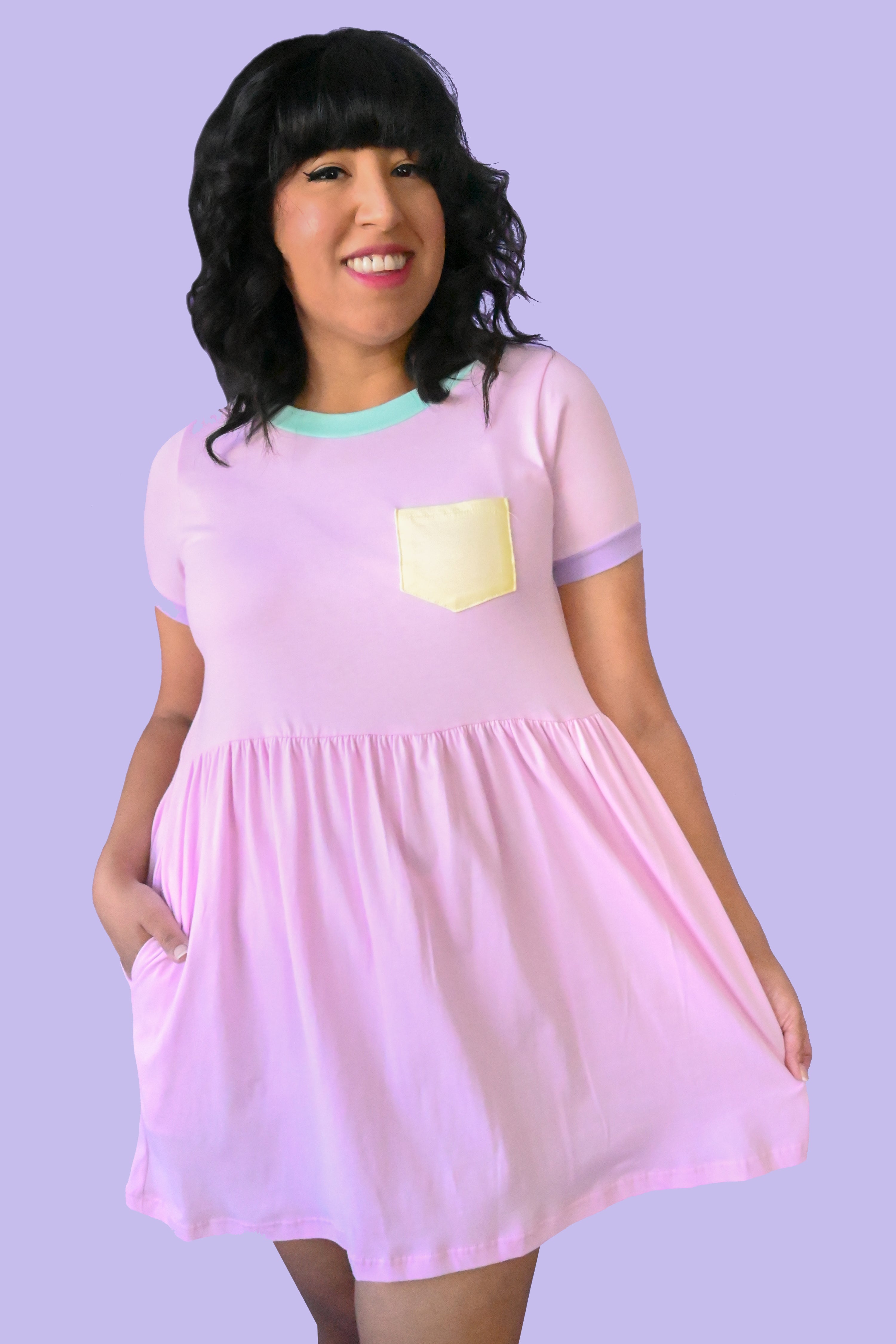 pink t shirt dress with mint collar, purple sleeve trim, and yellow lapel pocket