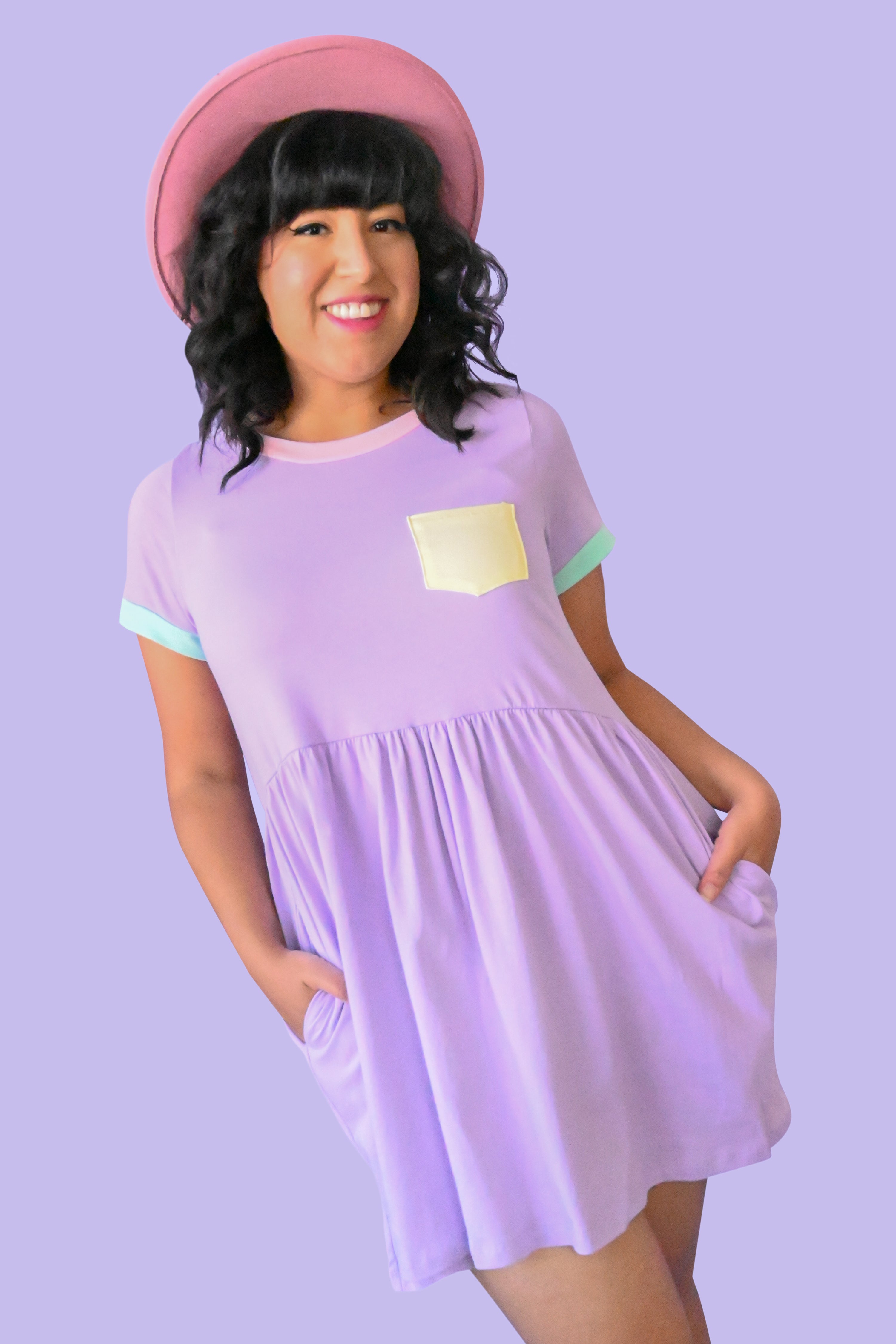 purple t shirt dress with pink collar, yellow lapel pocket, and mint sleeve trim.