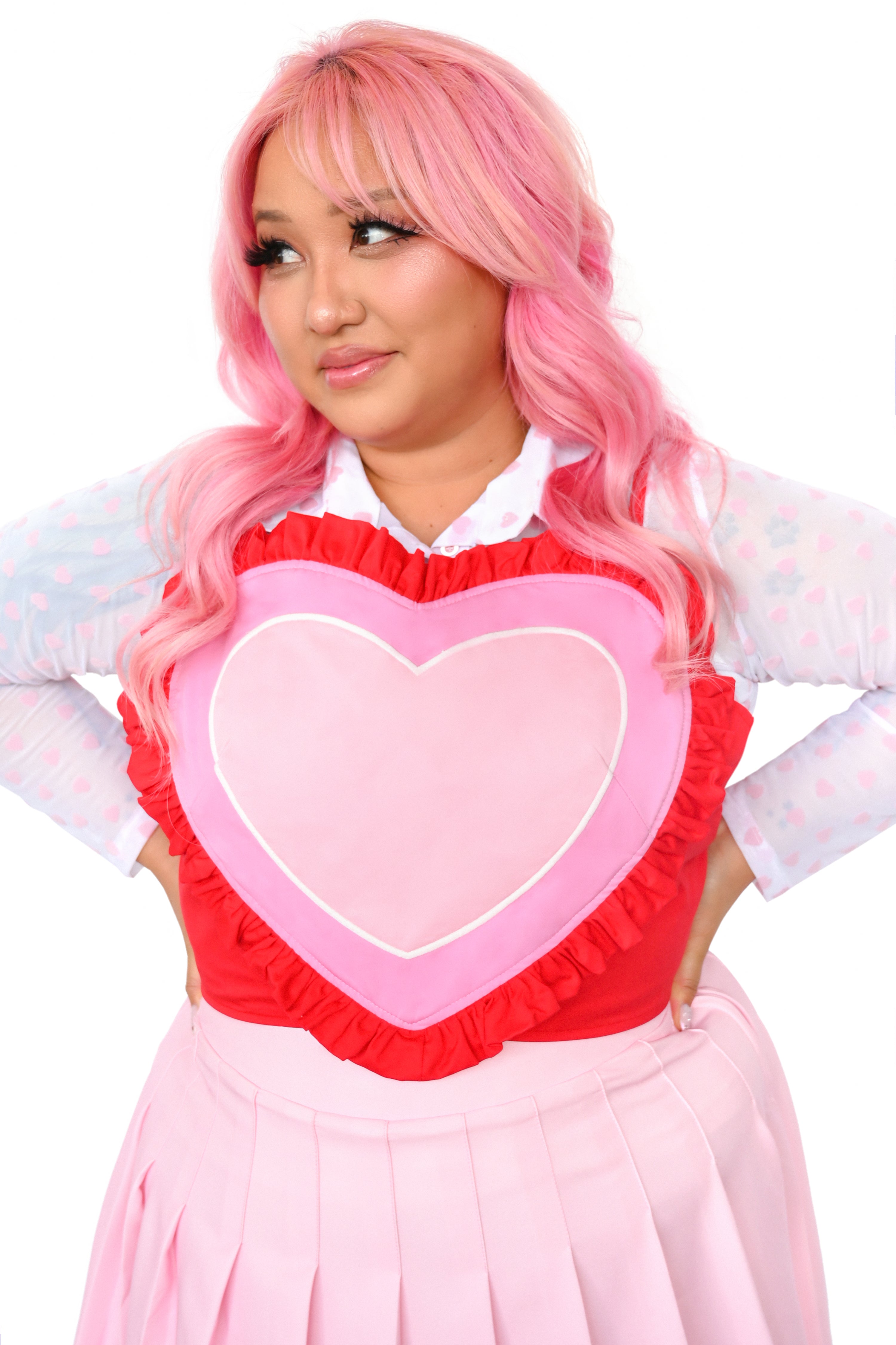 This red, pink, light pink, and white heart shaped corset top has adjustable straps and a lace-up back. The Base color of the corset top is red and a red ruffle surrounds the other colours of the heart.