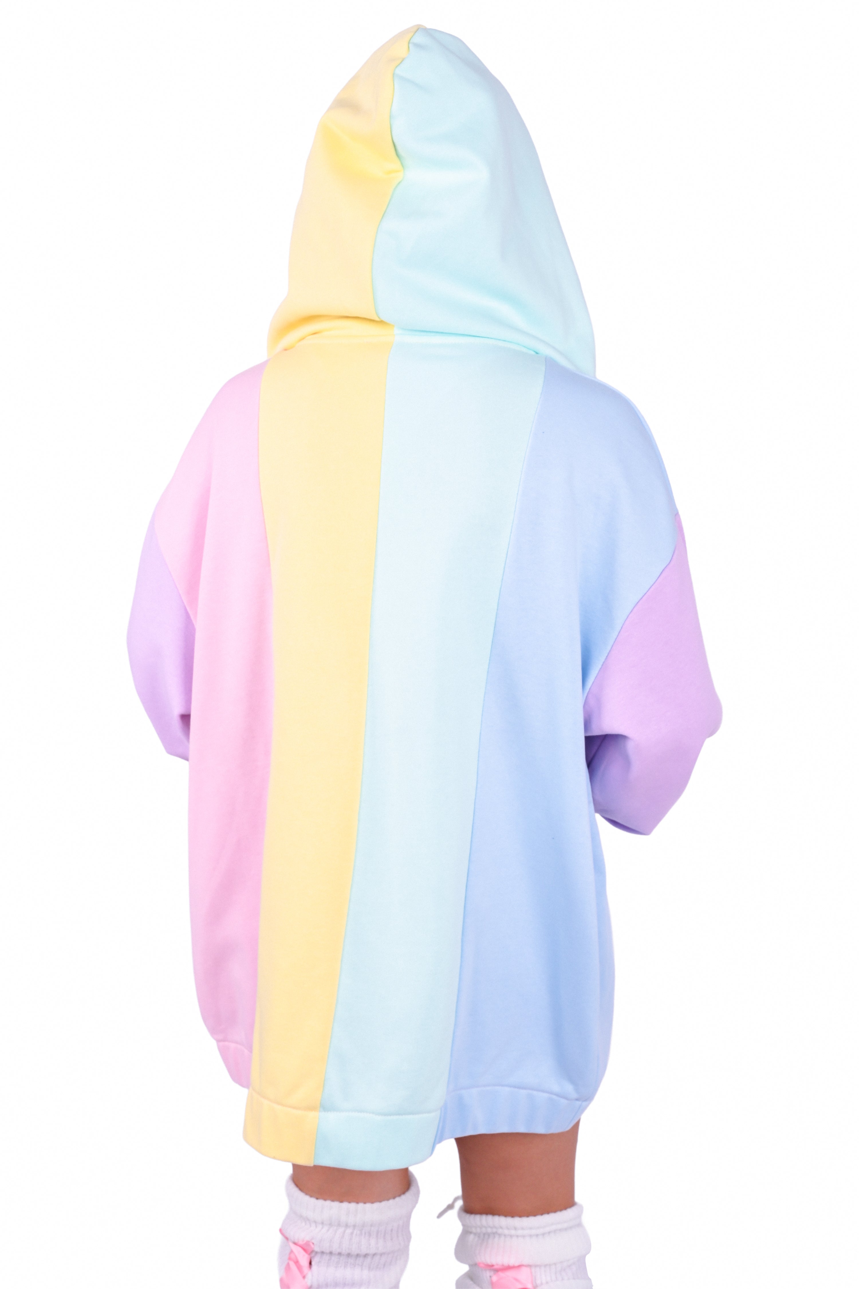 Person wearing a rainbow pastel colored blocked hoodie 