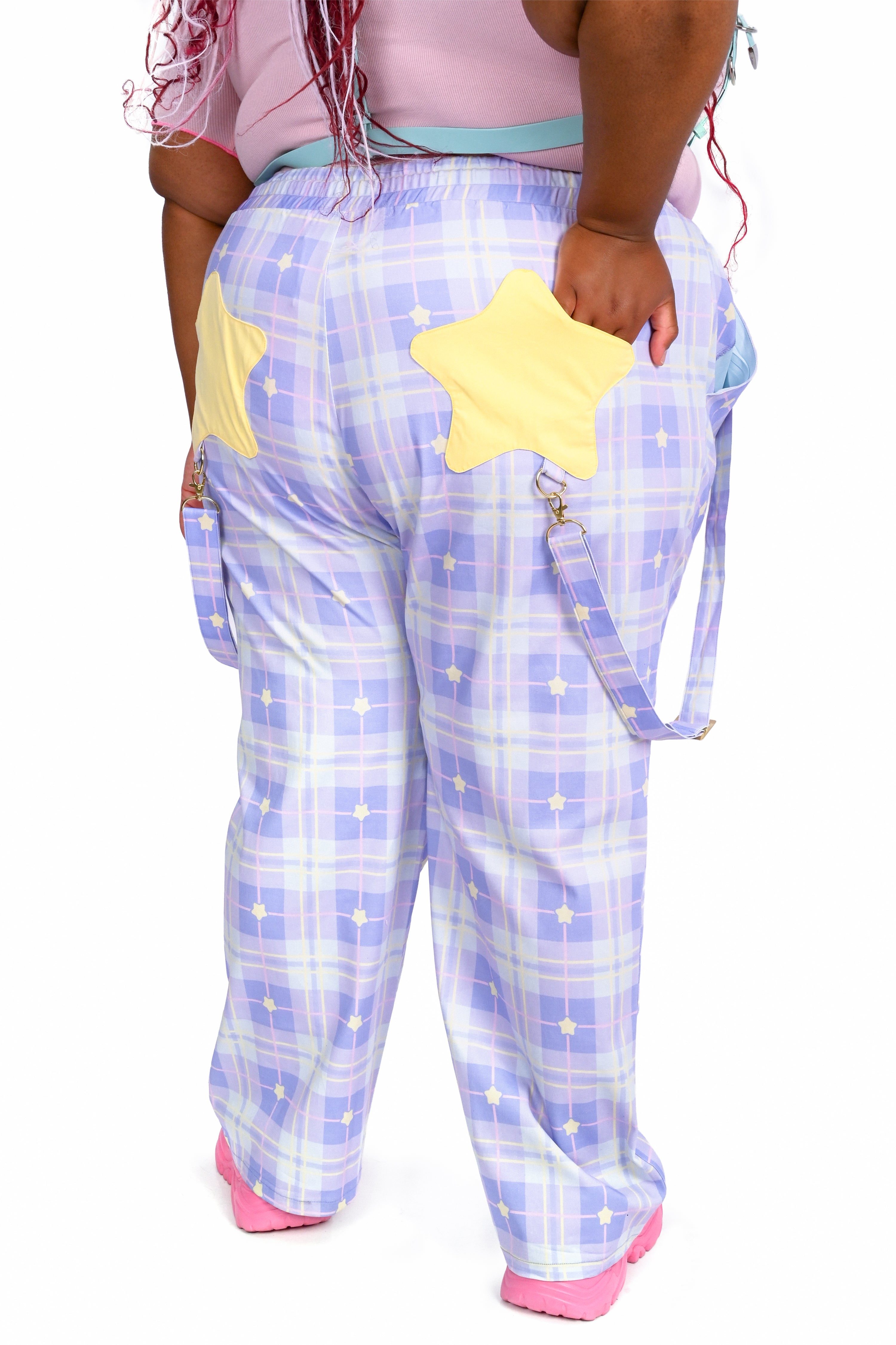 Plaid pajama pants with a yellow star design on a white background