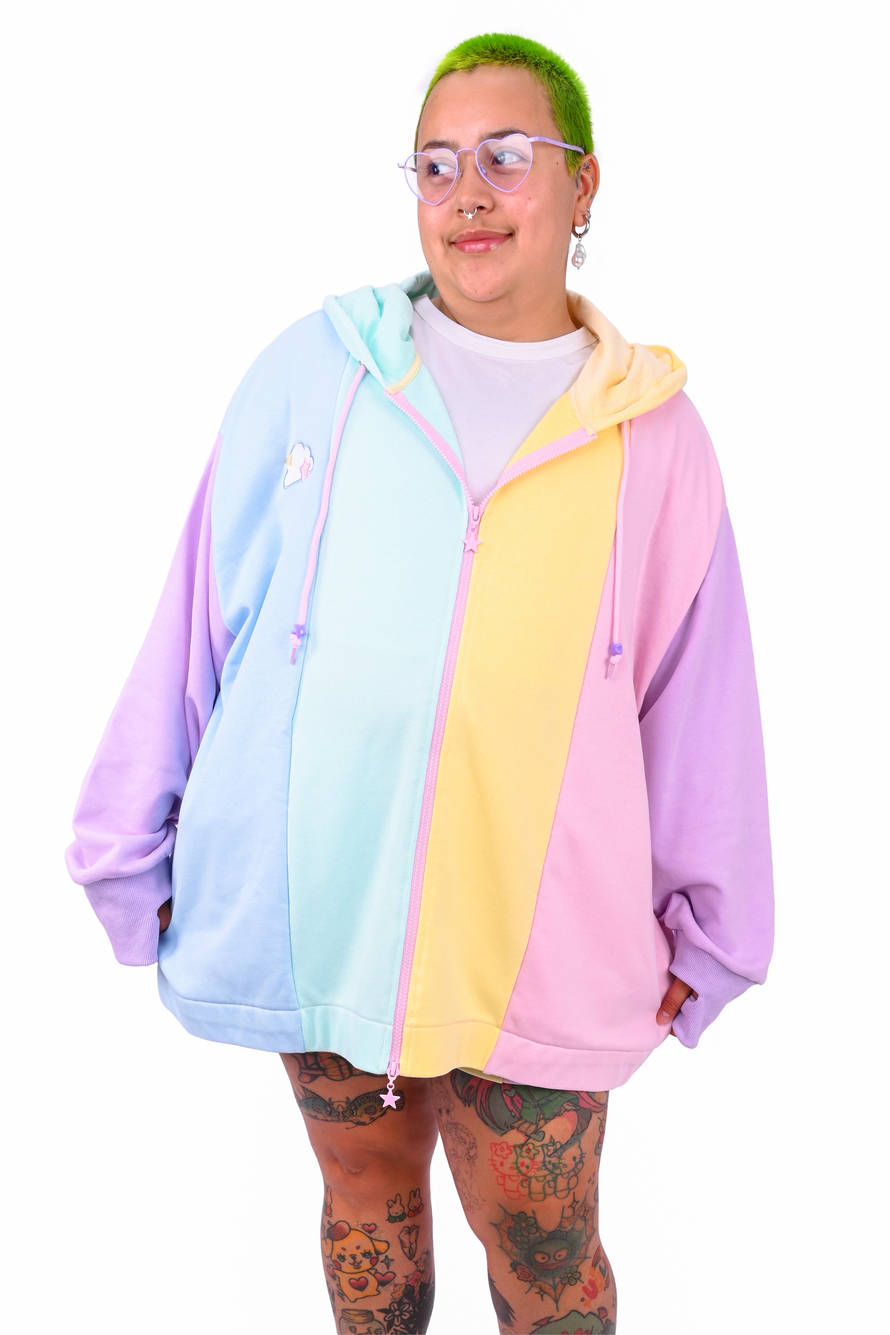 Person wearing a rainbow pastel colored blocked hoodie 