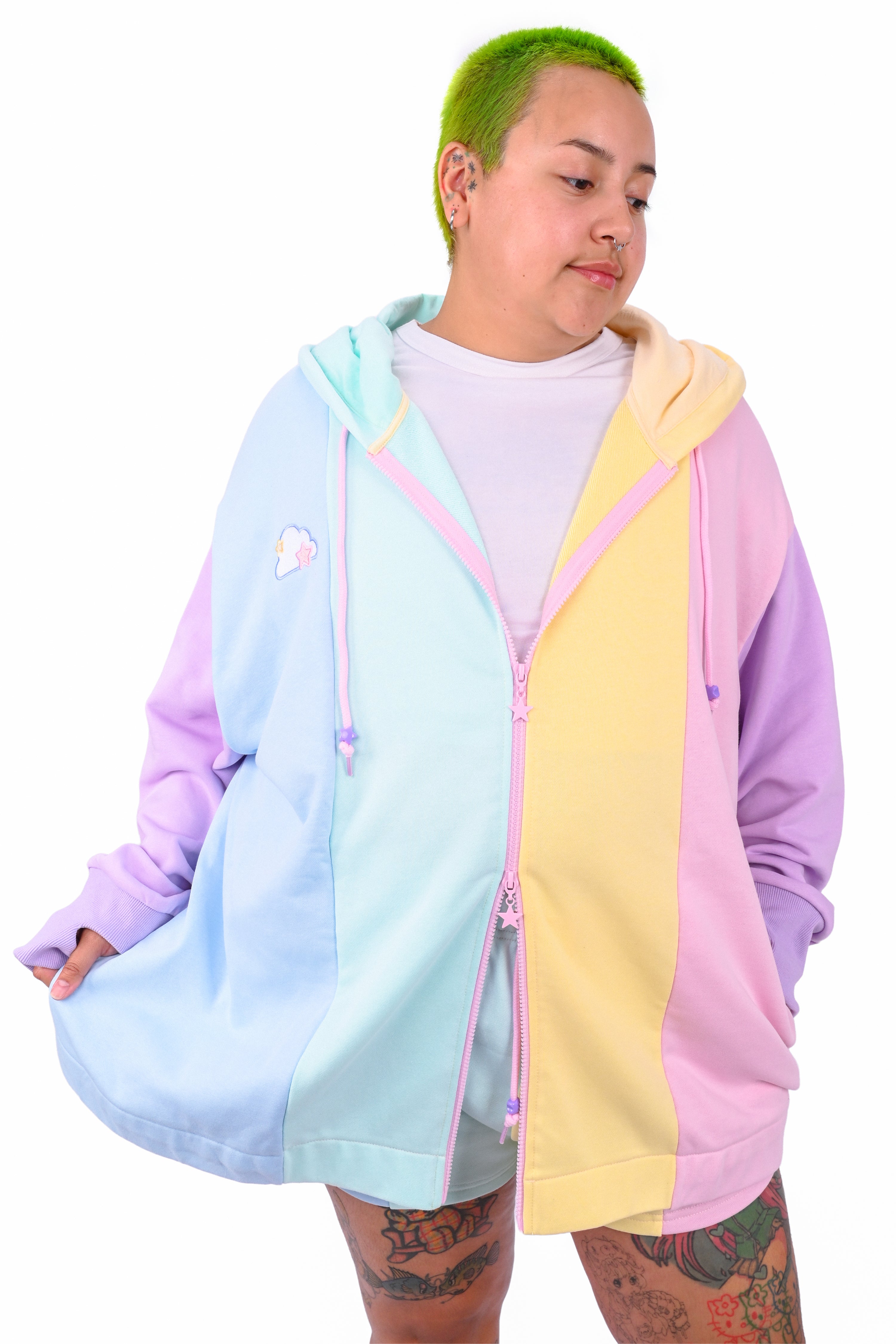 Person wearing a rainbow pastel colored blocked hoodie 