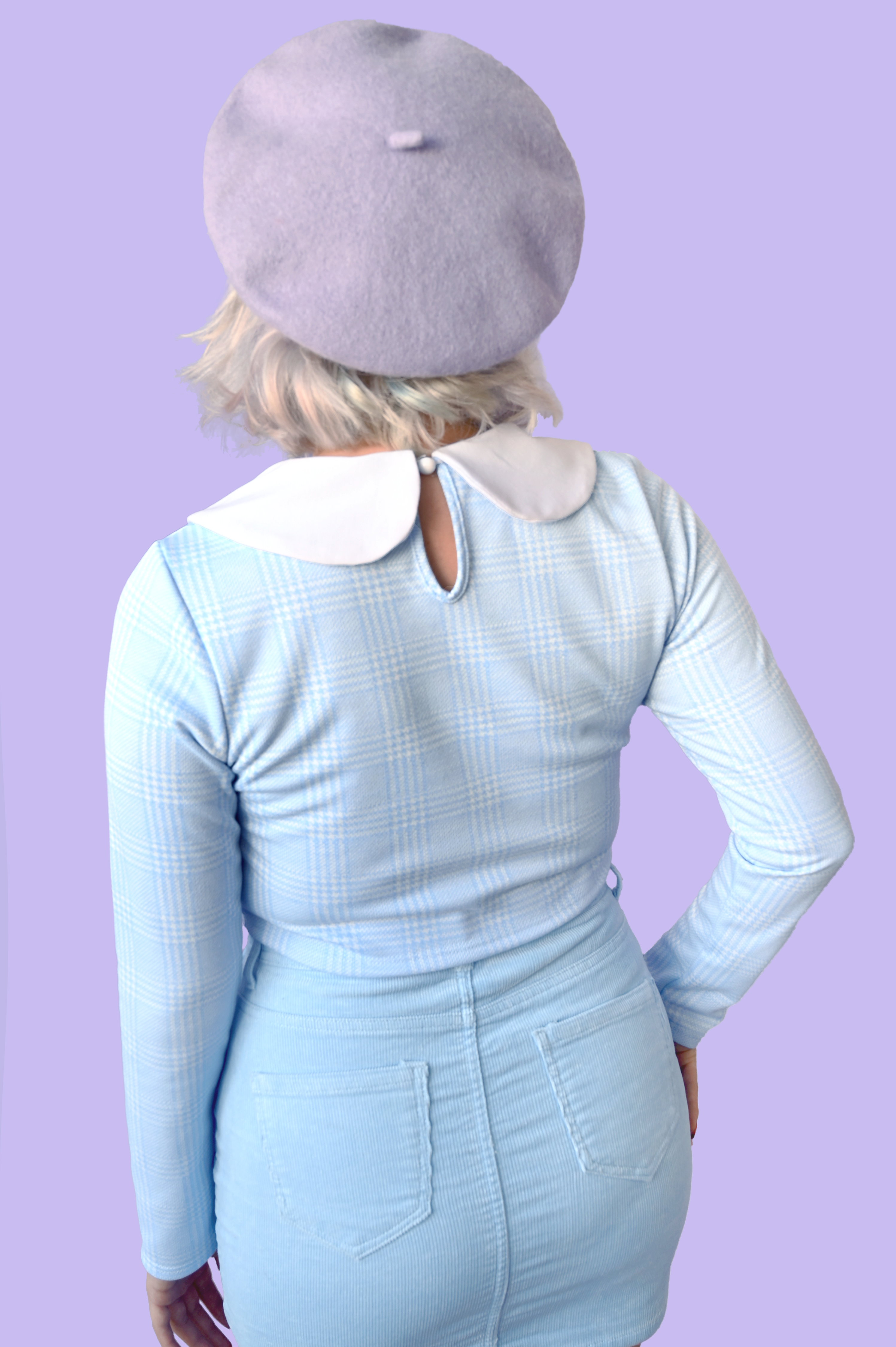Long sleeve crop top with adorable Peter Pan collar detail.  Back neck keyhole with button closure