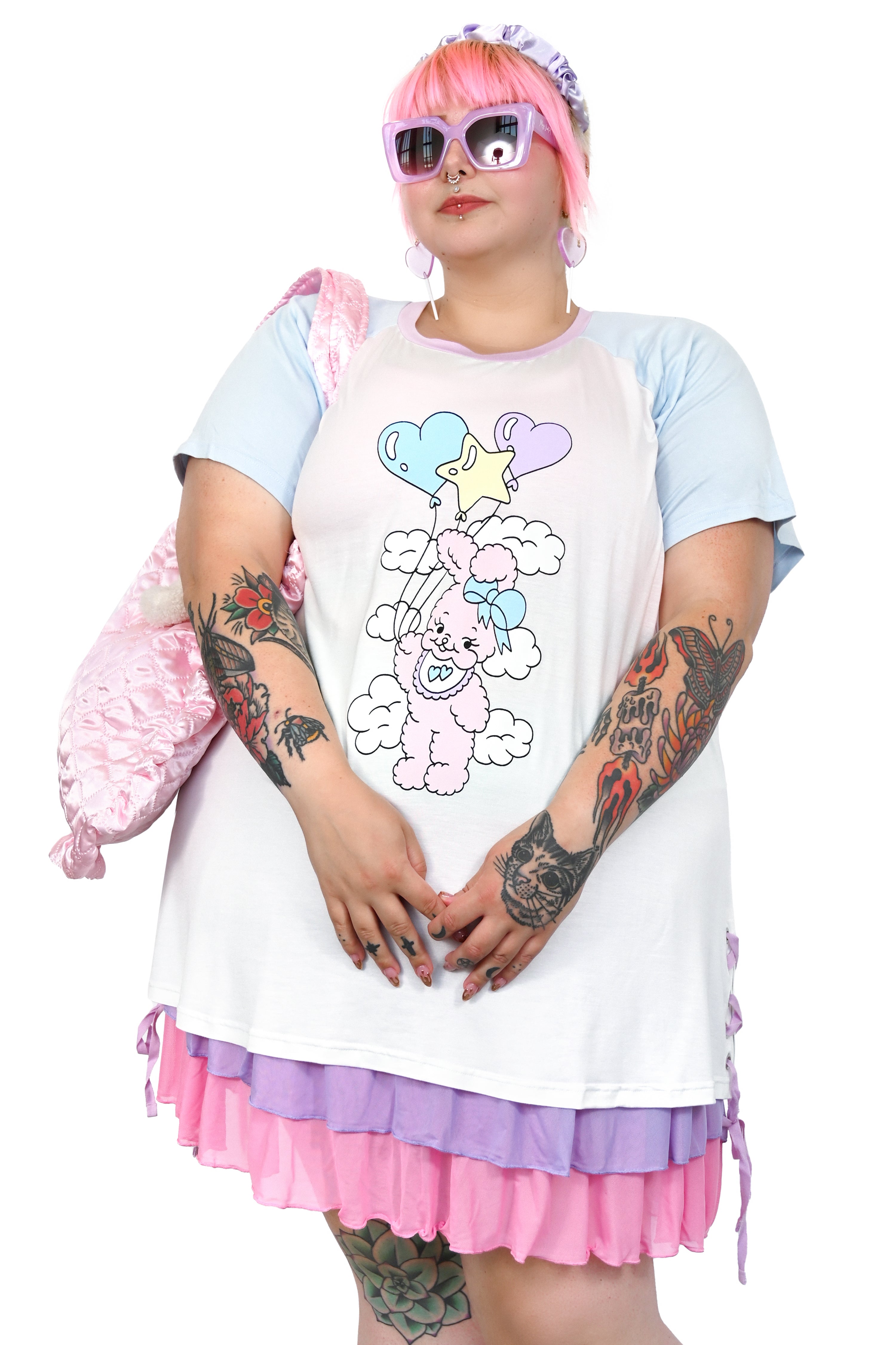 Care free bunny floating through the clouds on an array of cute balloons. Colorblock sleeves and collar and the cutest grommet lace up side detail. But that's not all, turn around and see that Cry Bear has your back!