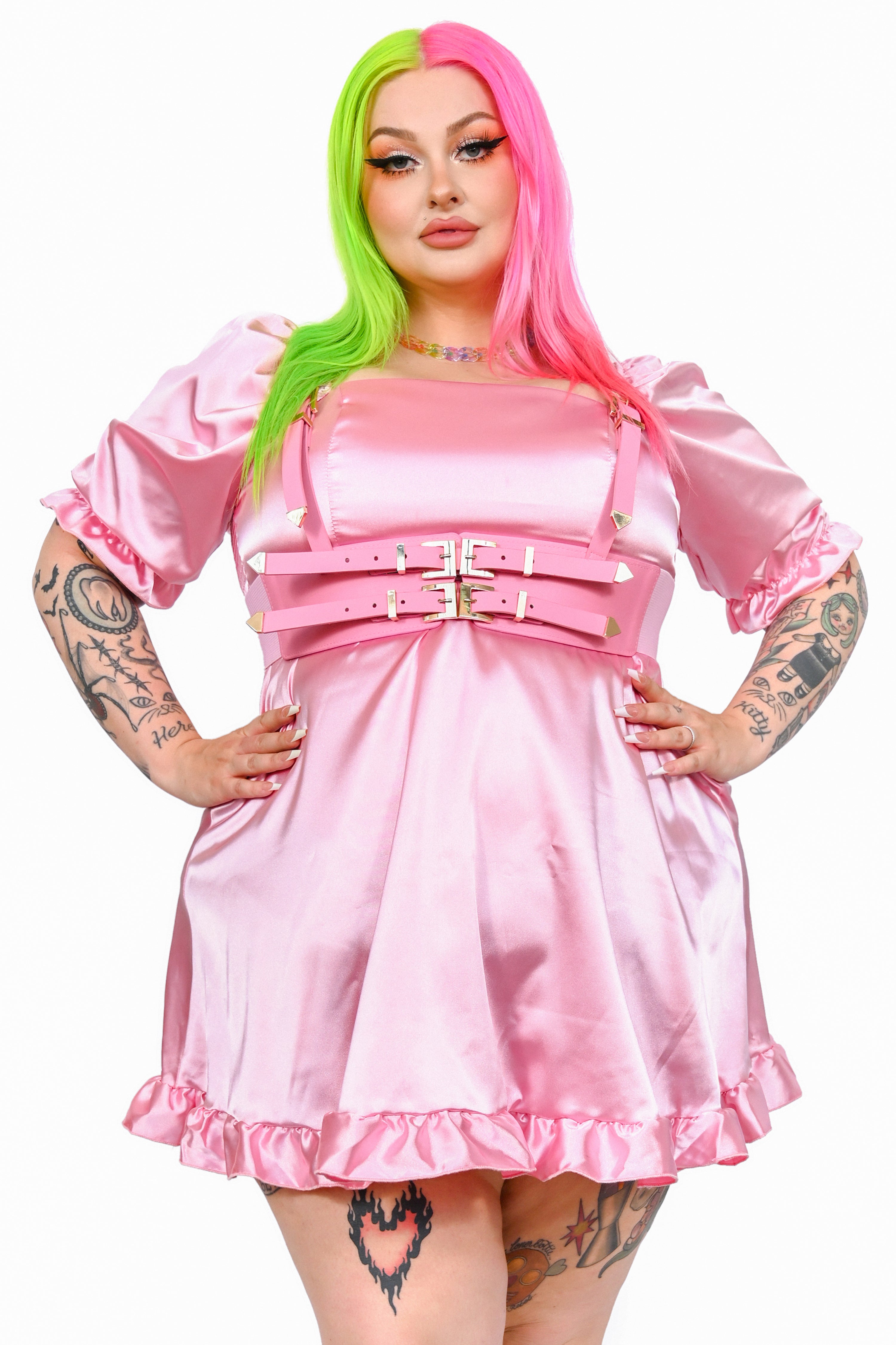 Baby pink satin babydoll dress with a square neckline, poofy sleeves with ruffle trim!
