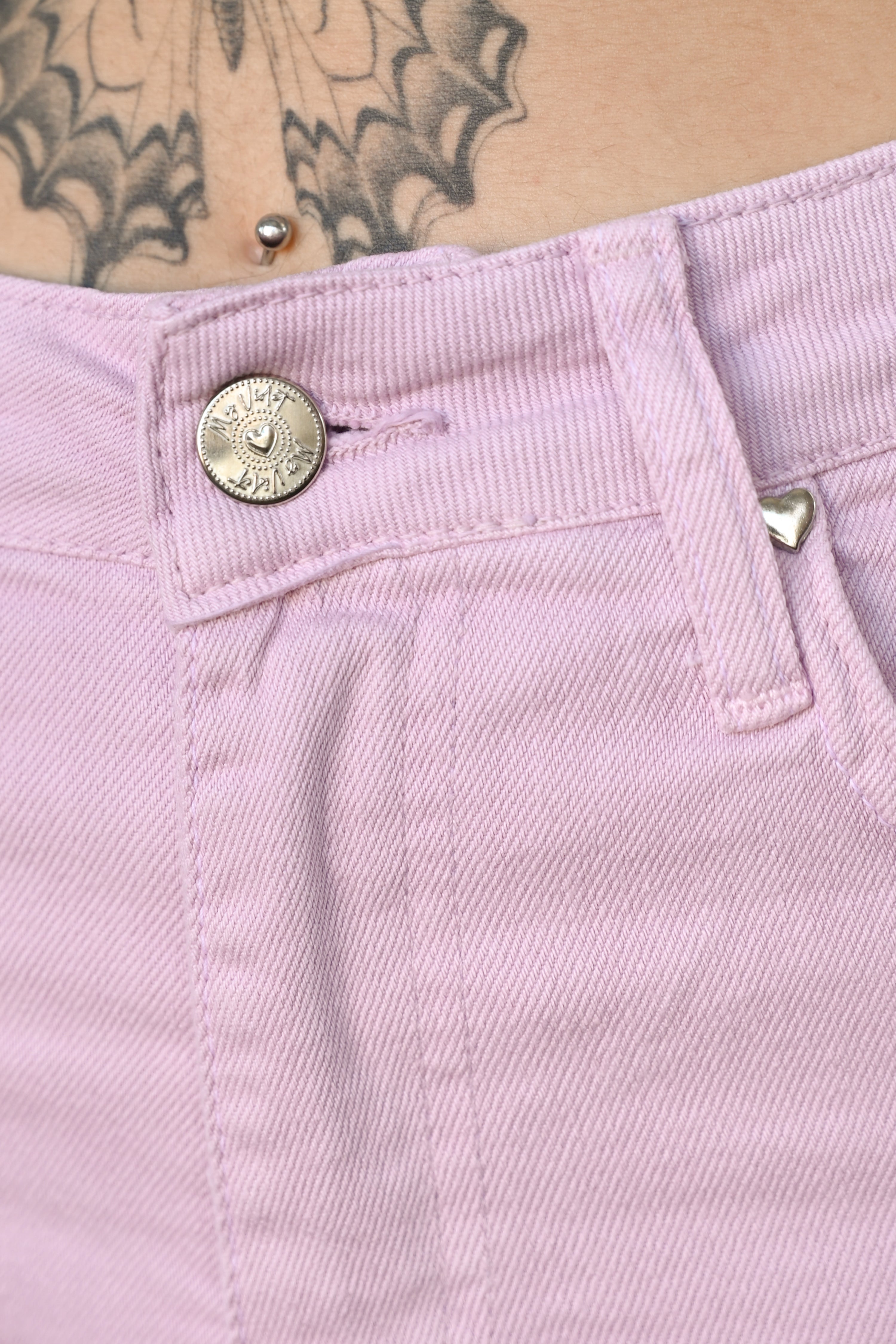 Close up of the MV front button and tiny heart pocket hardware
