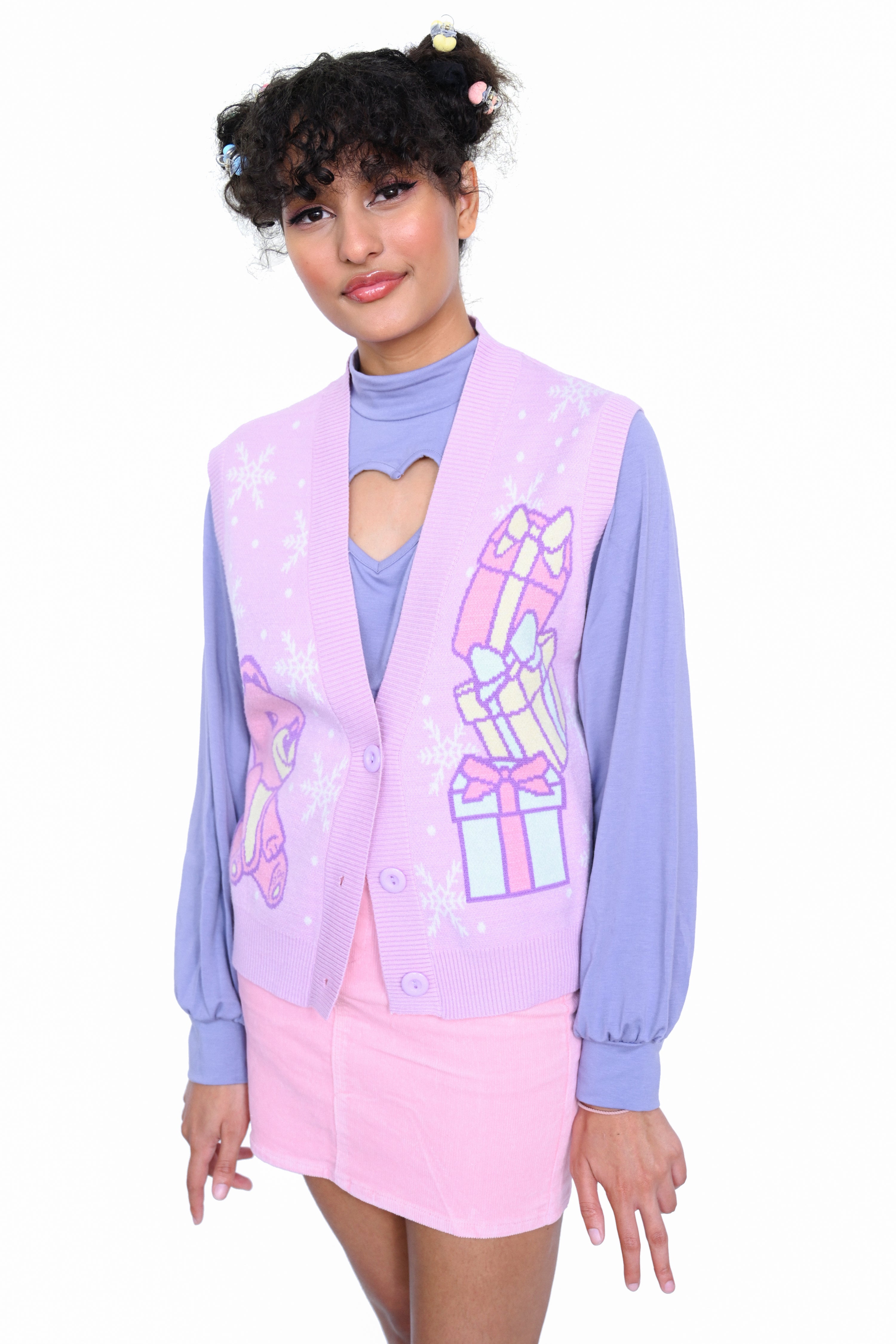 Knit button up sweater vest with pink bear, snowflakes, and gift boxes  Edit alt text