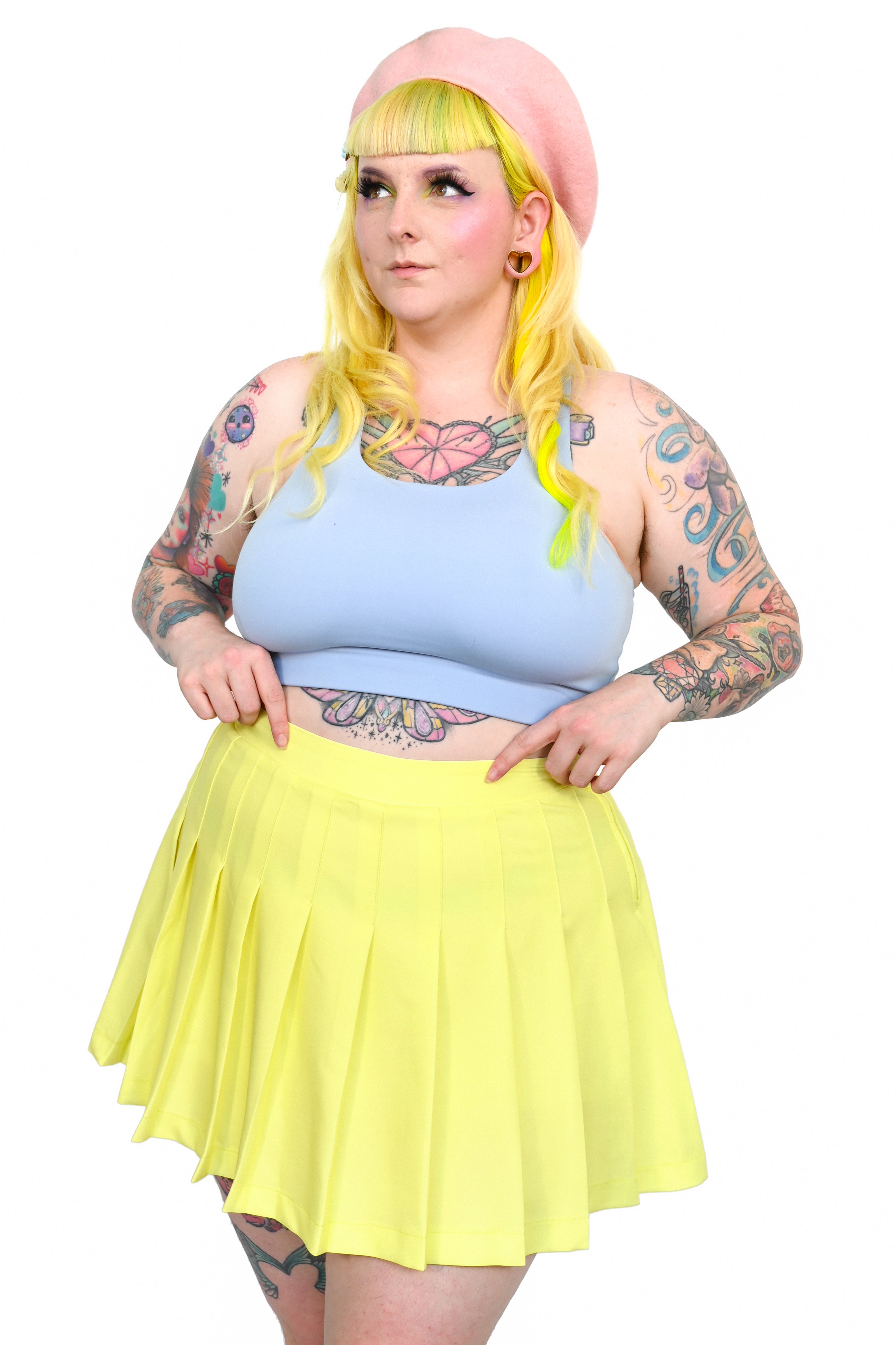 Bright yellow pleated skirt with side zipper and built in safety shorts