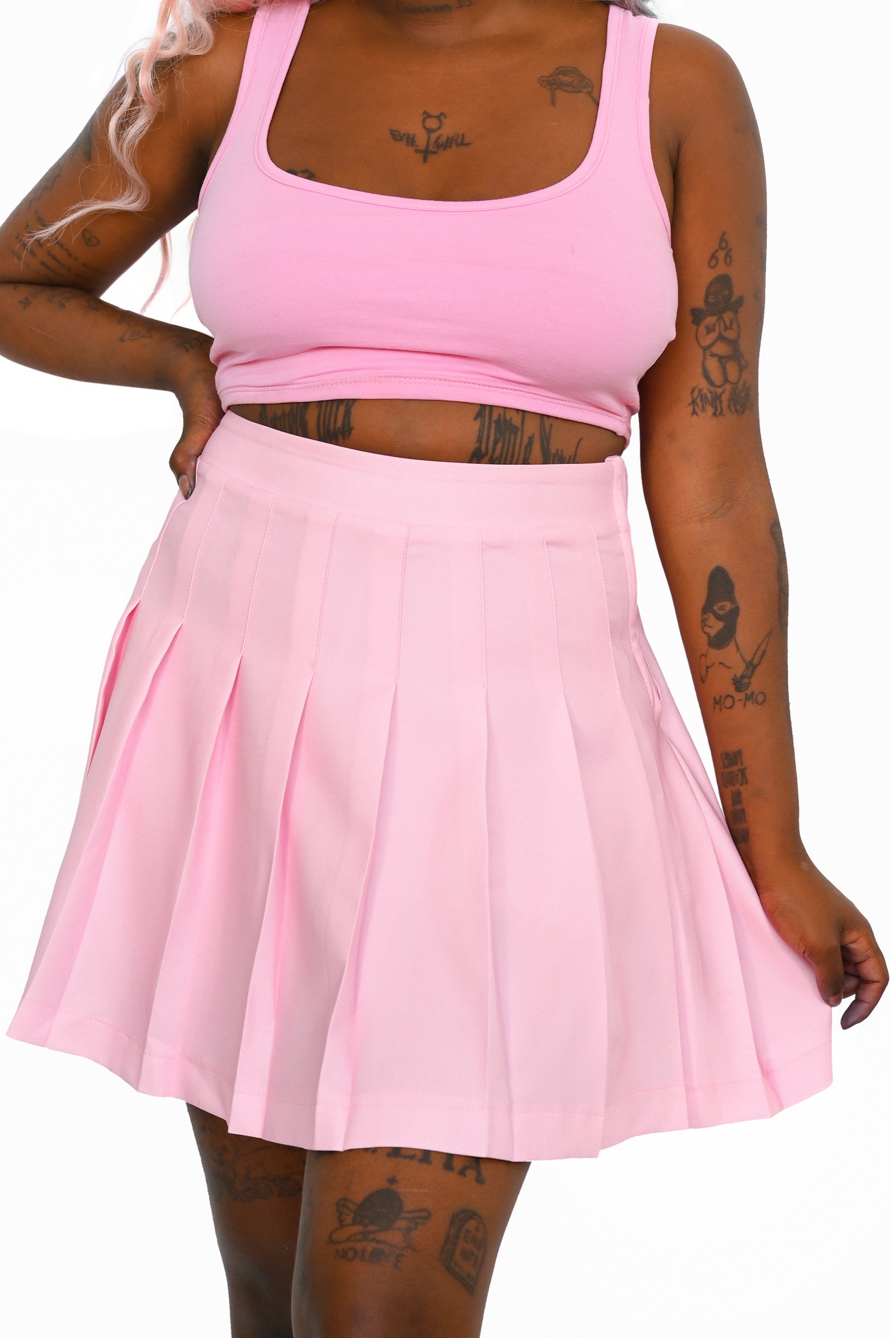 Pink pleated skirt with side zipper and built in safety shorts