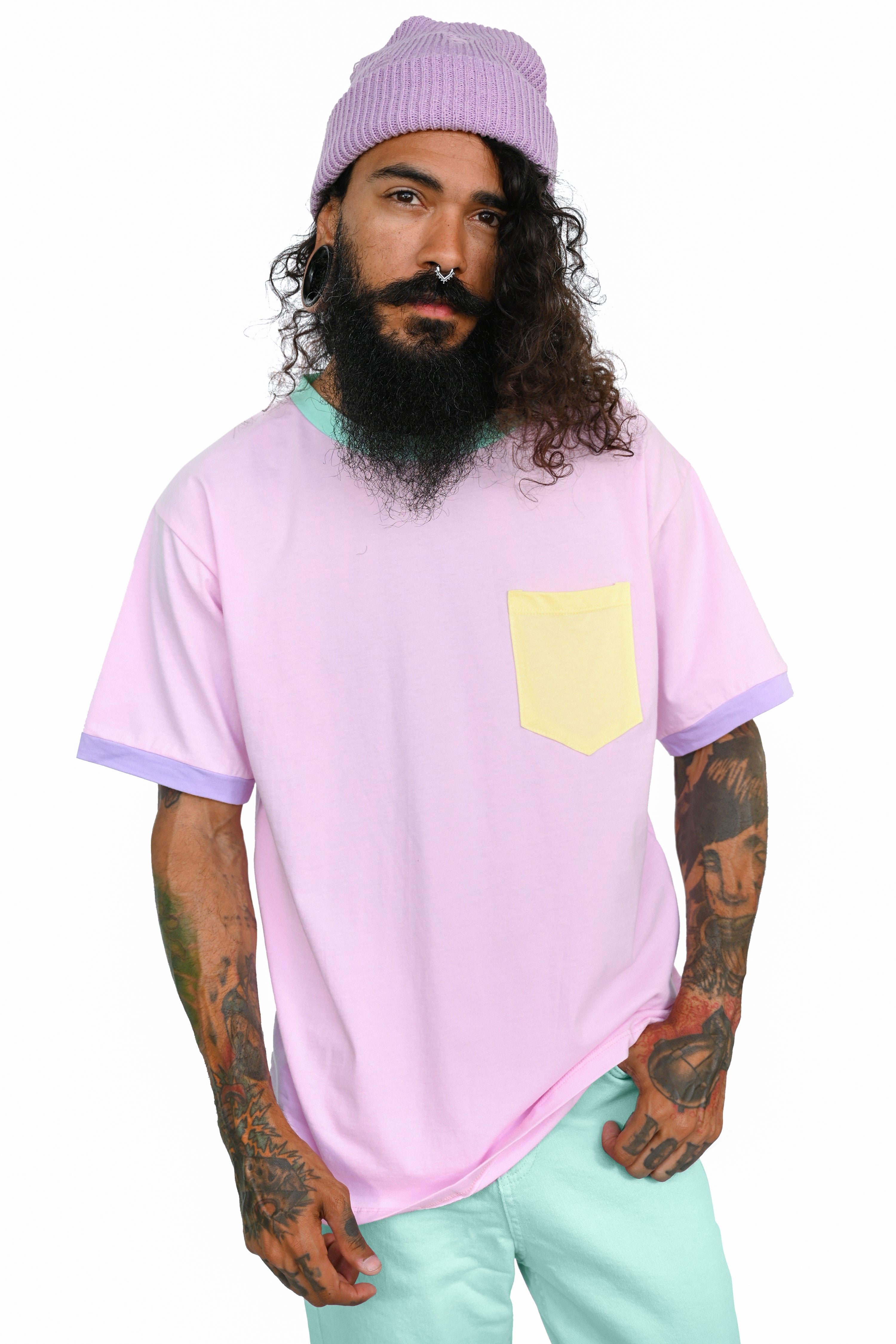 pink colorblock unisex tee with yellow pocket, lavender sleeve cuffs, and mint collar