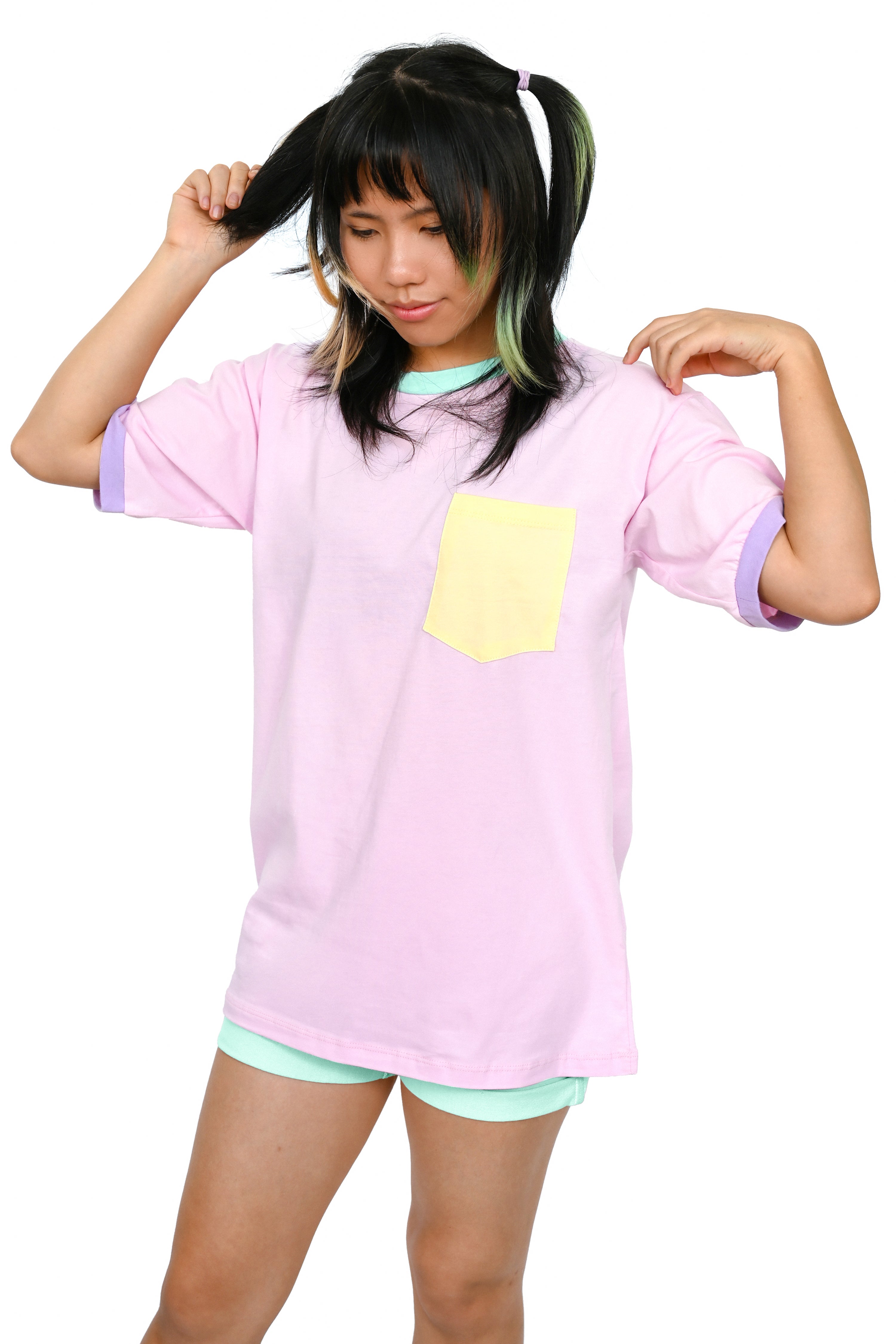 pink colorblock unisex tee with yellow pocket, lavender sleeve cuffs, and mint collar