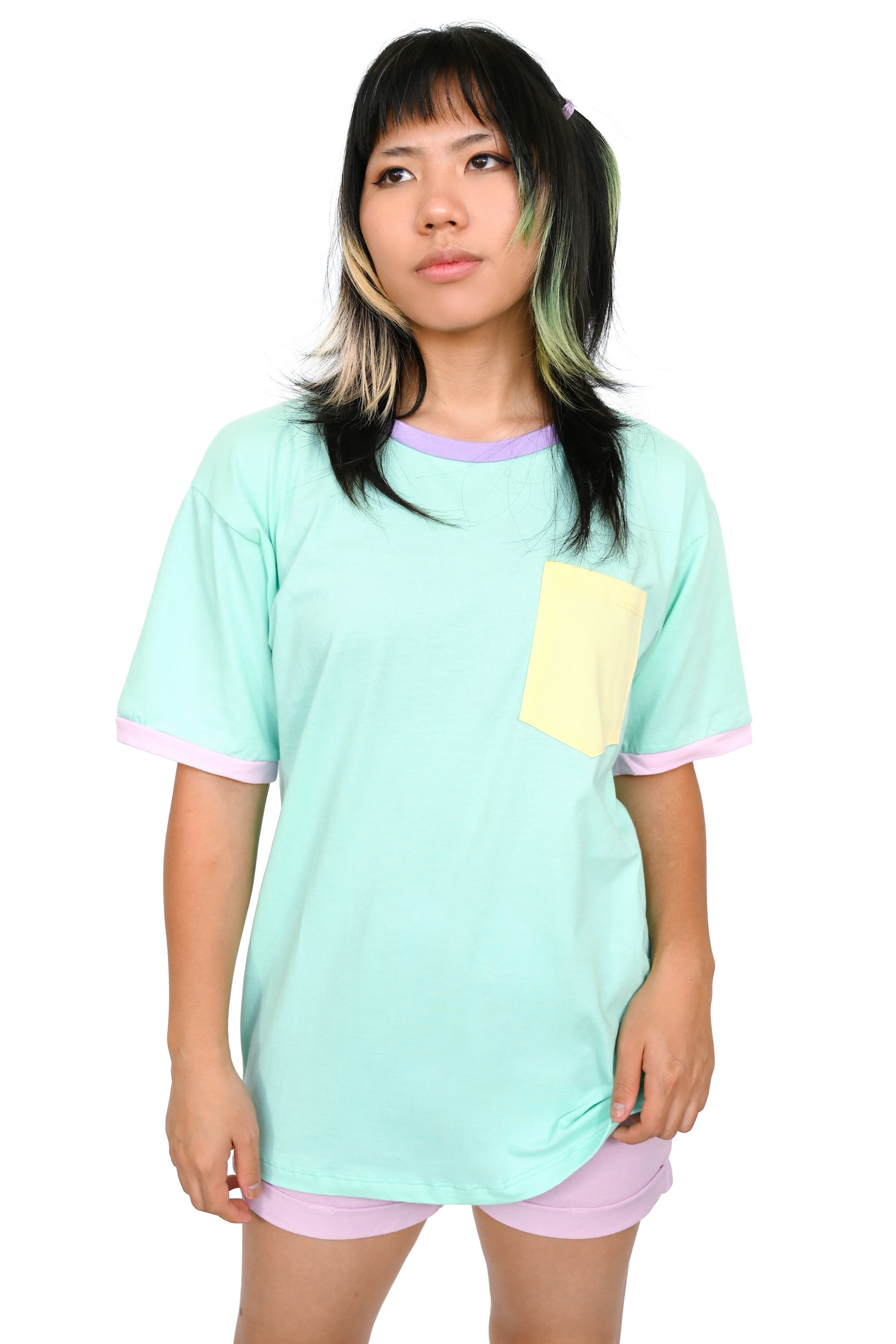 mint colorblock unisex t shirt with pink sleeve trim, yellow pocket, and lavender collar