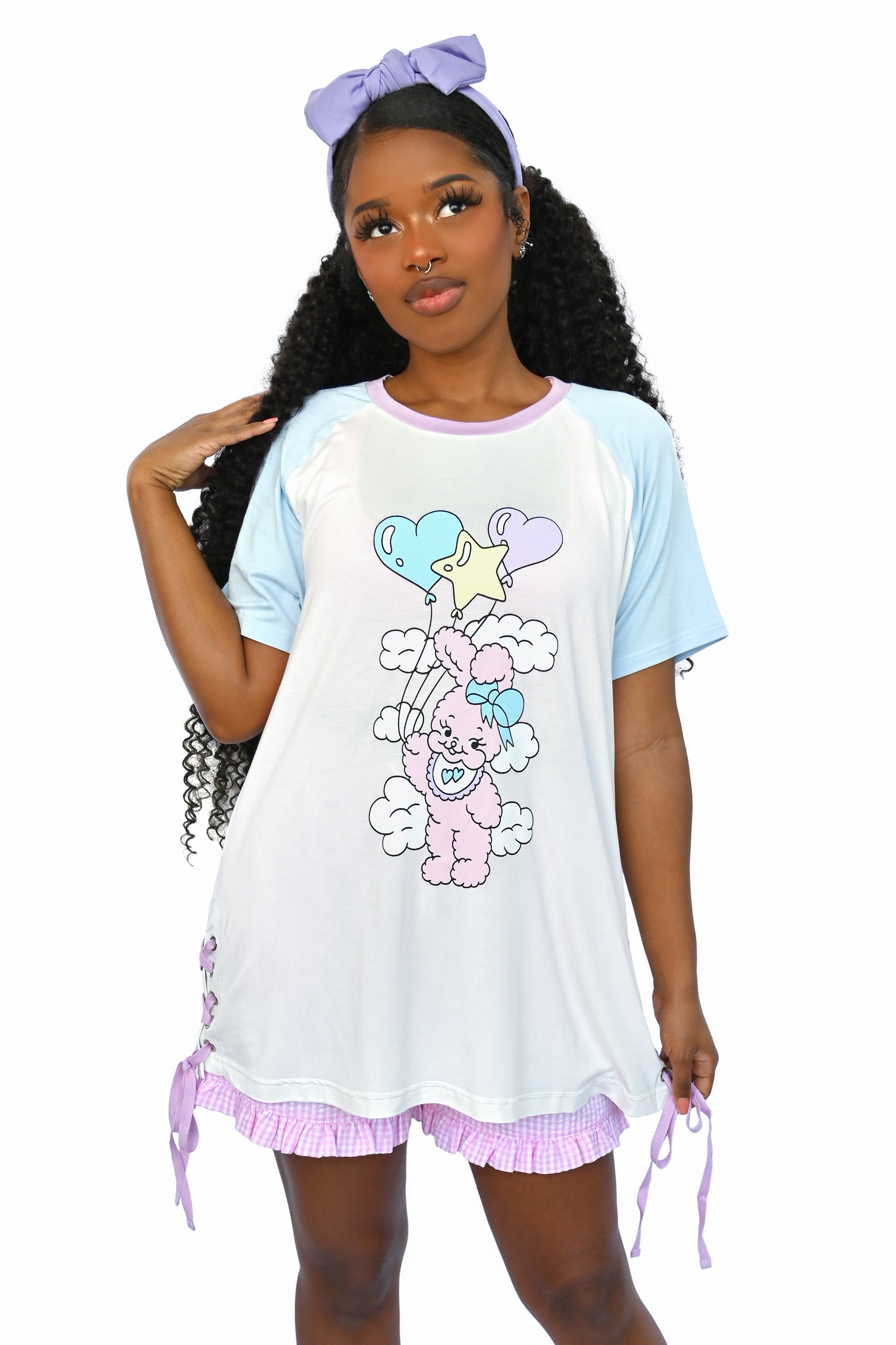 Care free bunny floating through the clouds on an array of cute balloons. Colorblock sleeves and collar and the cutest grommet lace up side detail. But that's not all, turn around and see that Cry Bear has your back!