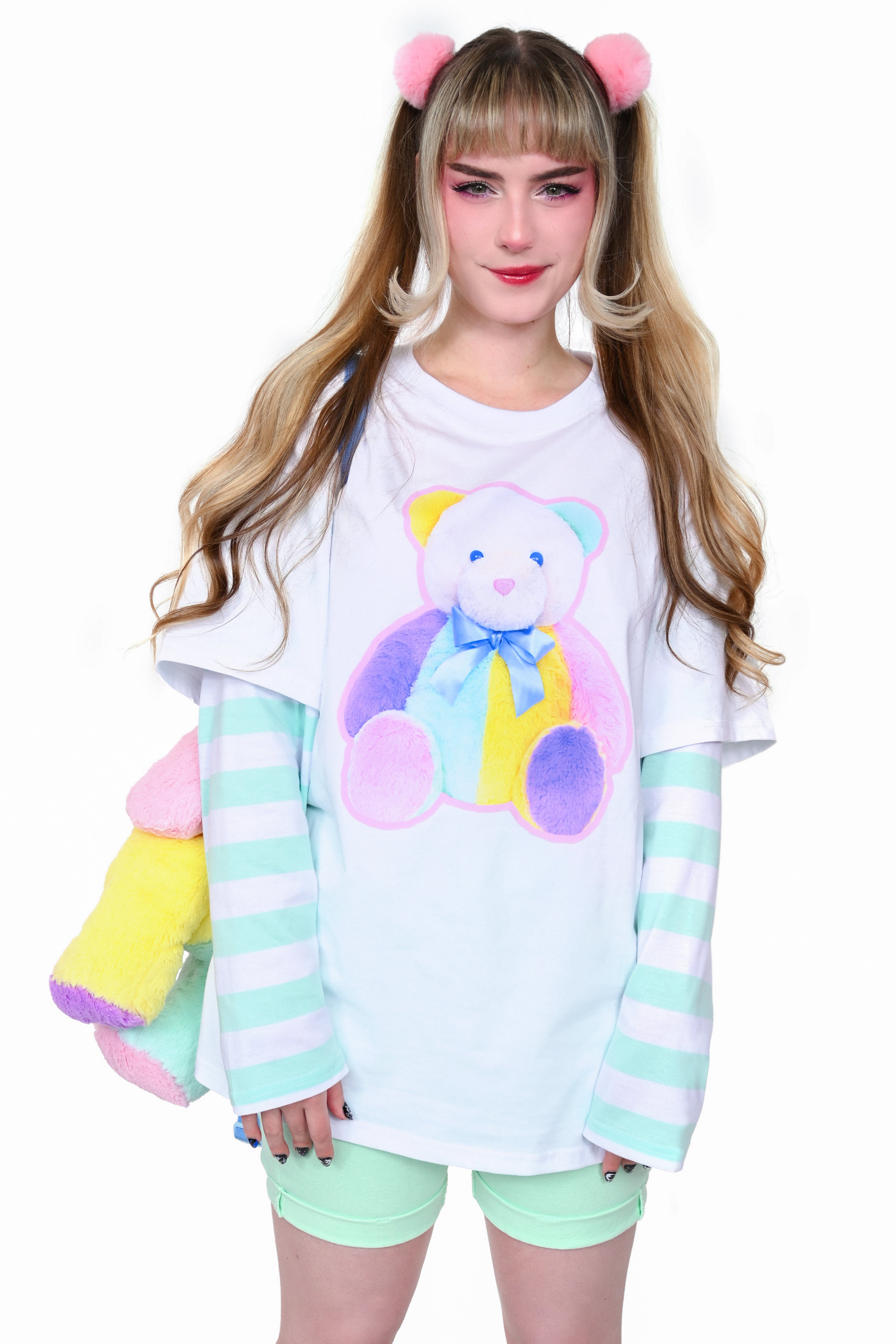 Long sleeve white T shirt with white and mint striped long sleeves. Pastel stuffed bear screen print on the front