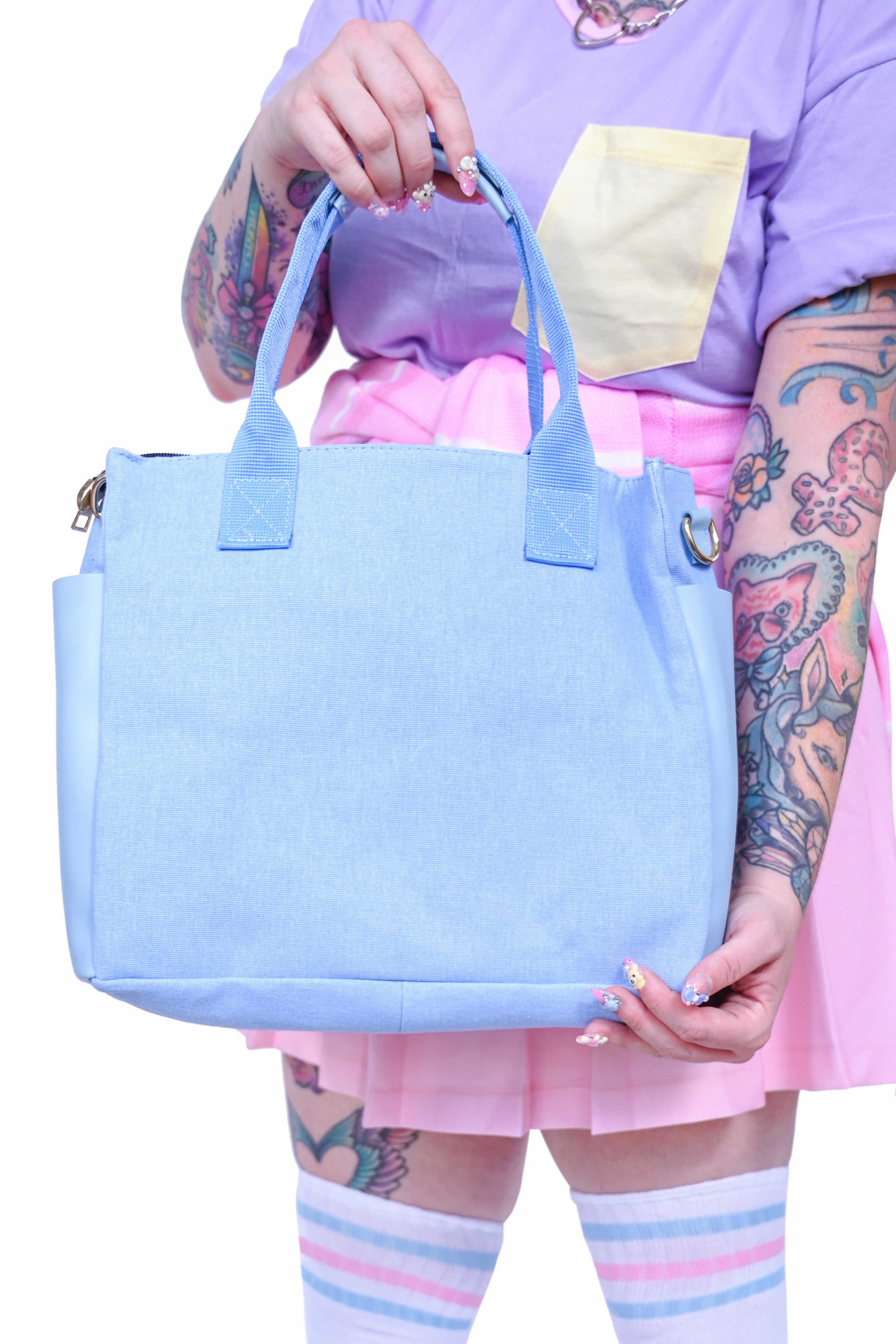 Rectangular blue bag with large outer pockets and two sturdy canvas straps