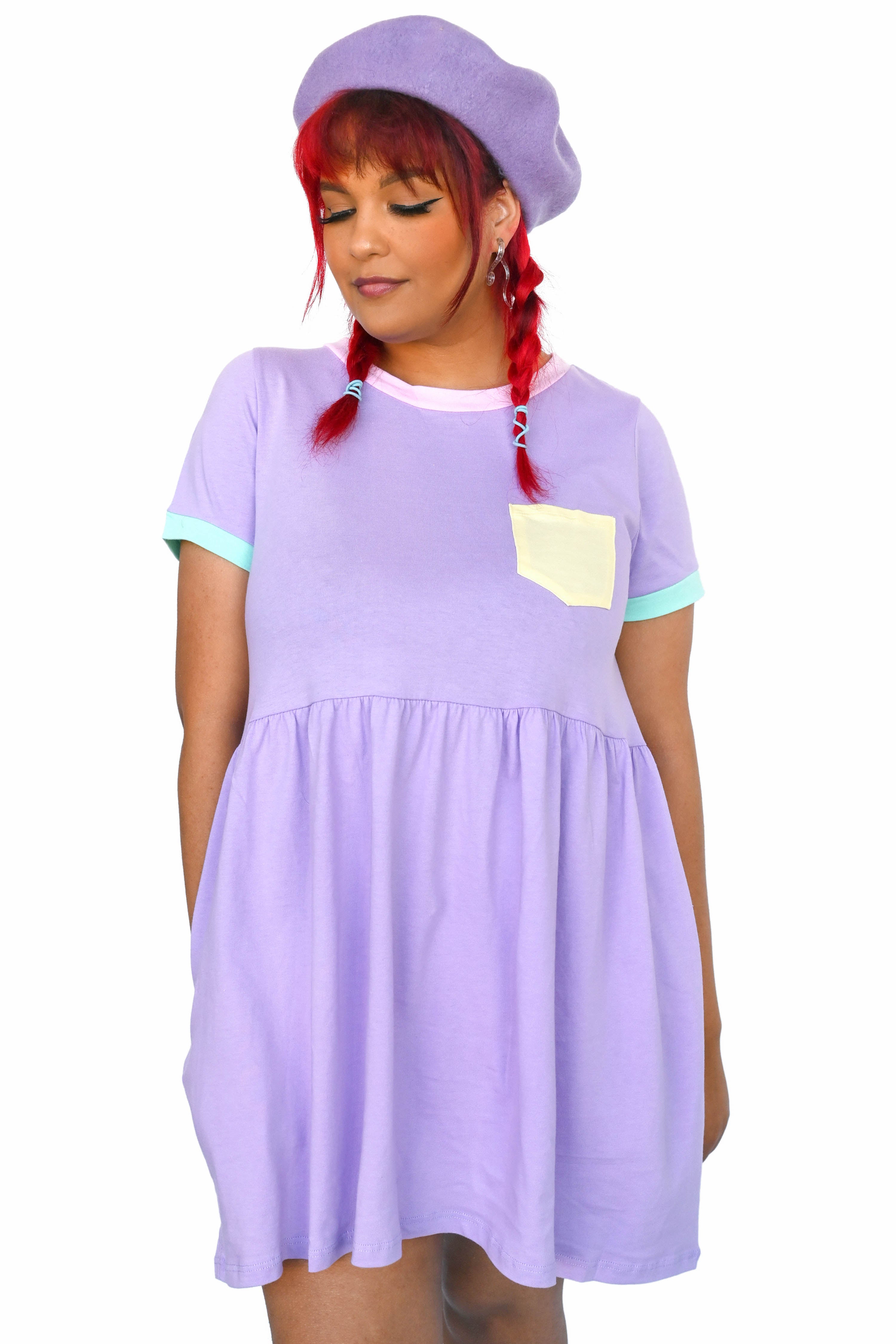 Model wearing lavender tee-shirt dress and matching beret