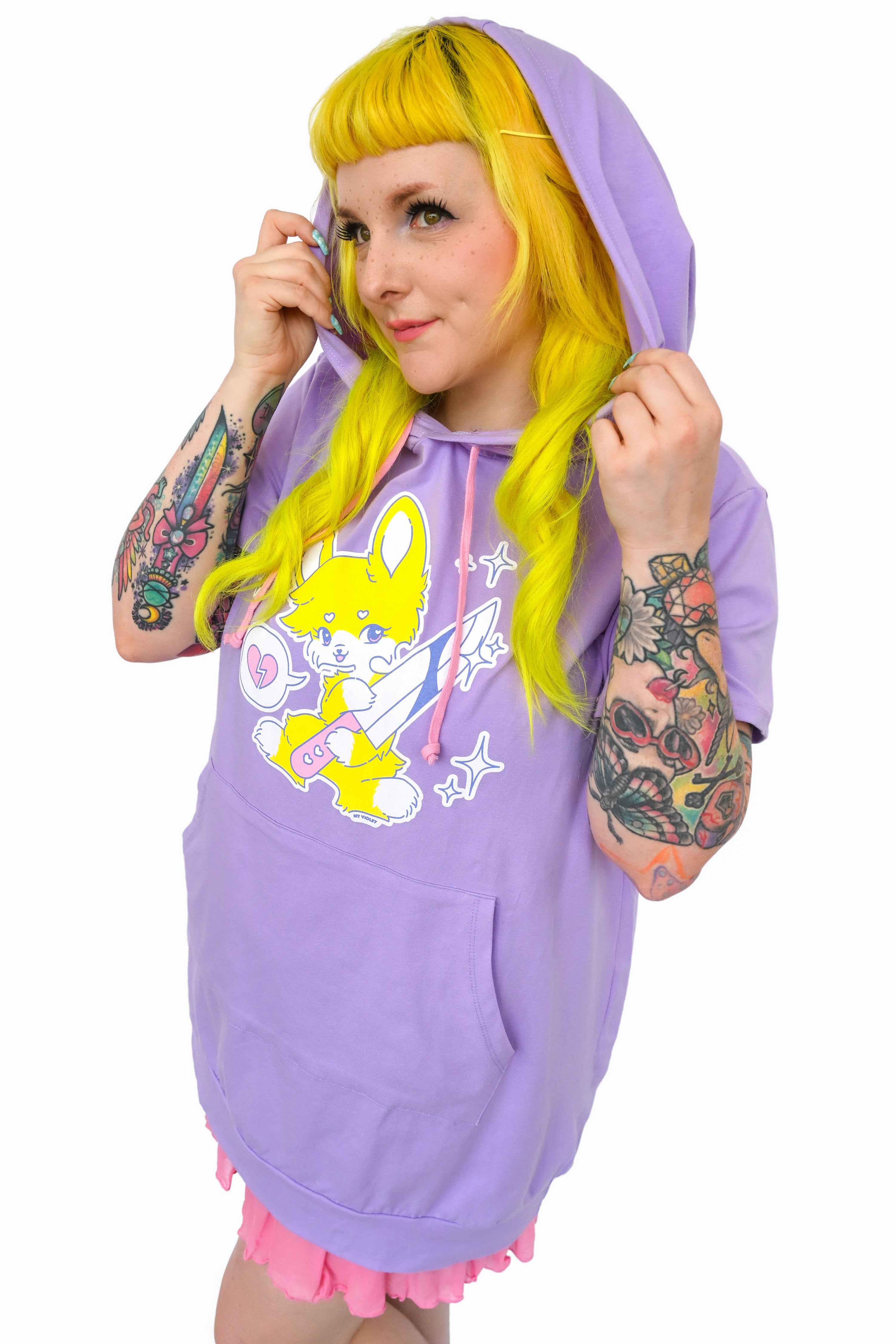 Lavender short sleeve hoodie featuring a yellow bunny holding a knife