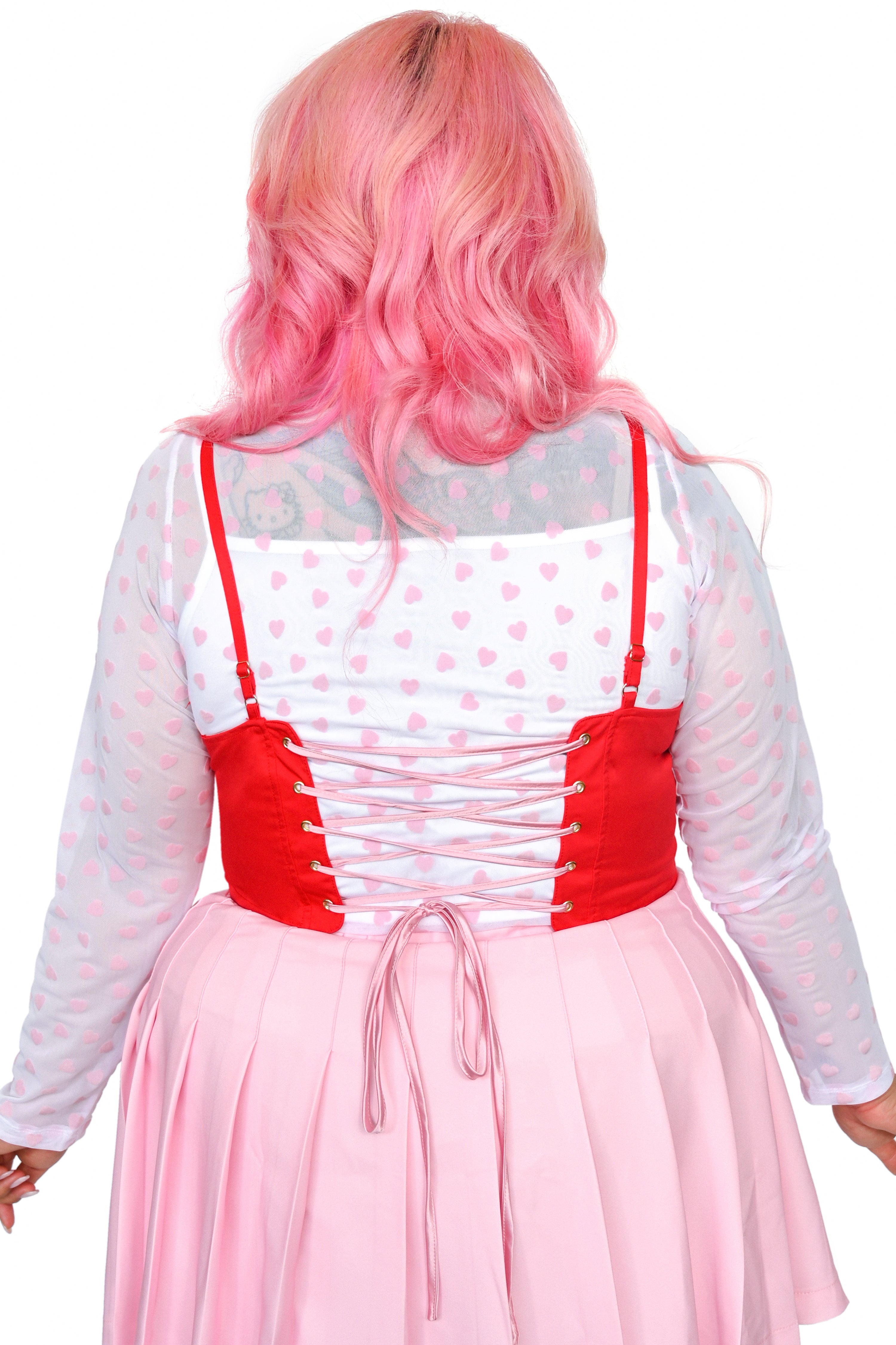 This red, pink, light pink, and white heart shaped corset top has adjustable straps and a lace-up back. The Base color of the corset top is red and a red ruffle surrounds the other colours of the heart.