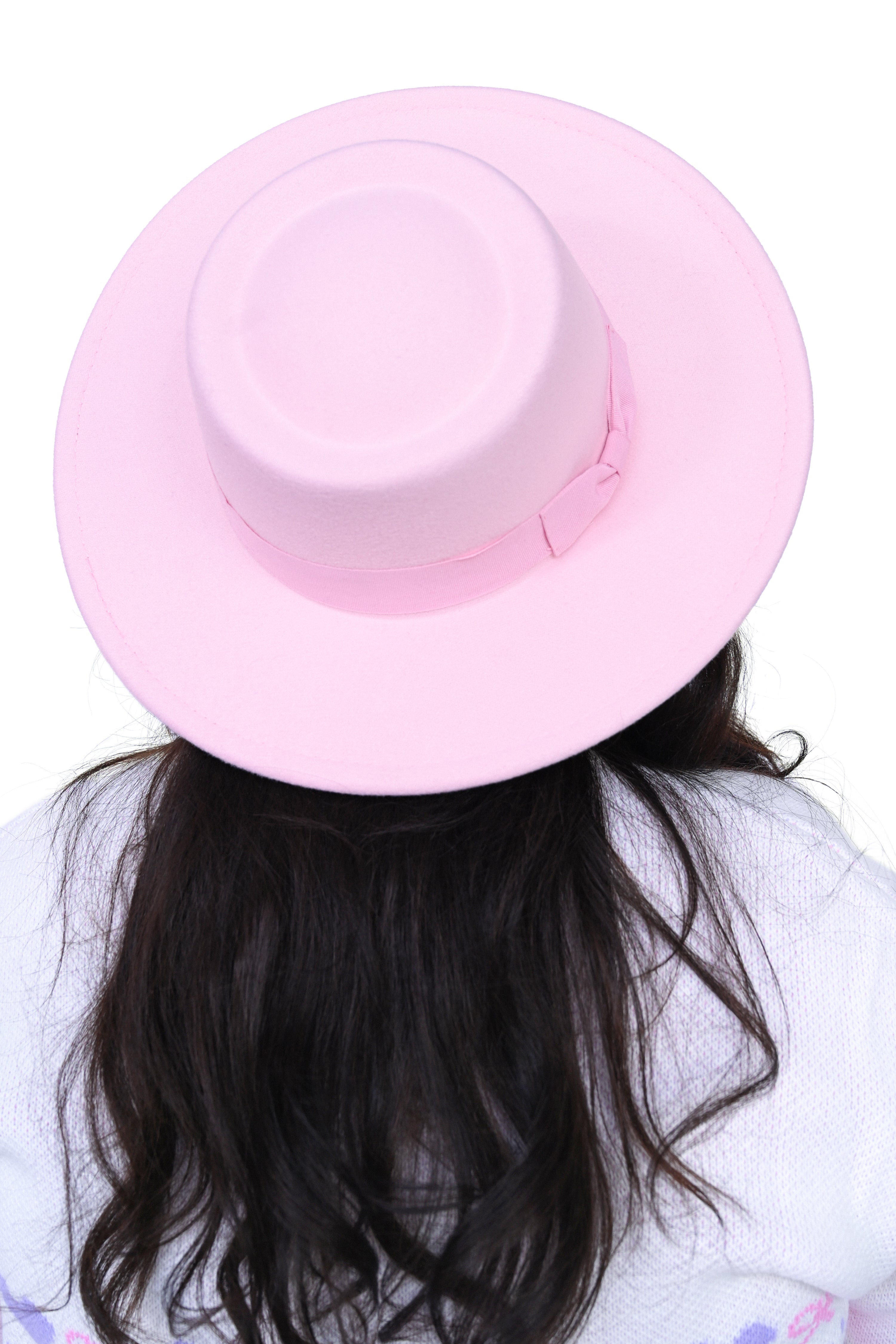 Pastel pink hard brim hat with bow detail on the hat band  Edit alt text