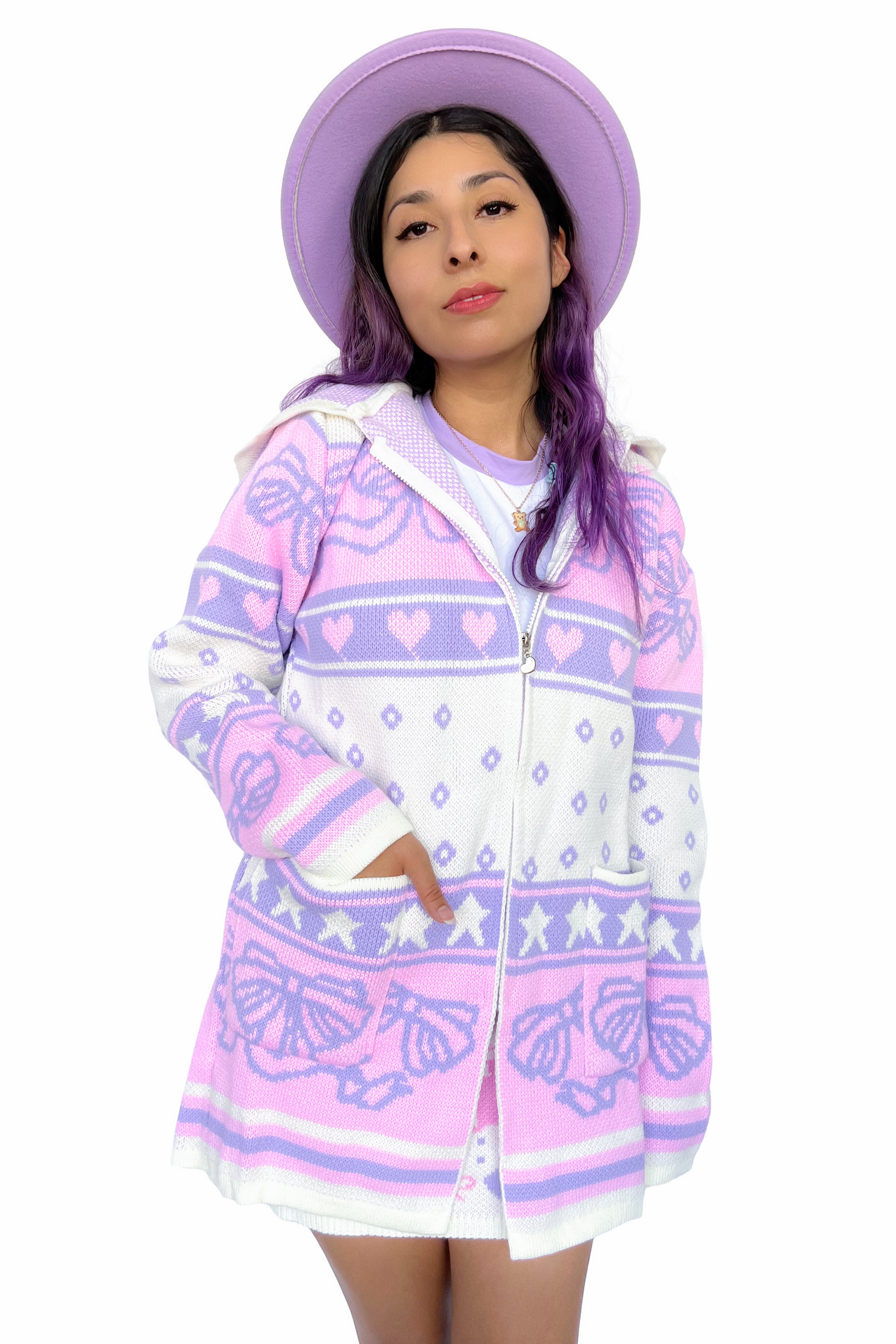 Thick zip up knit sweater with pink, lavender, and white knit, featuring bows, hearts, and stars