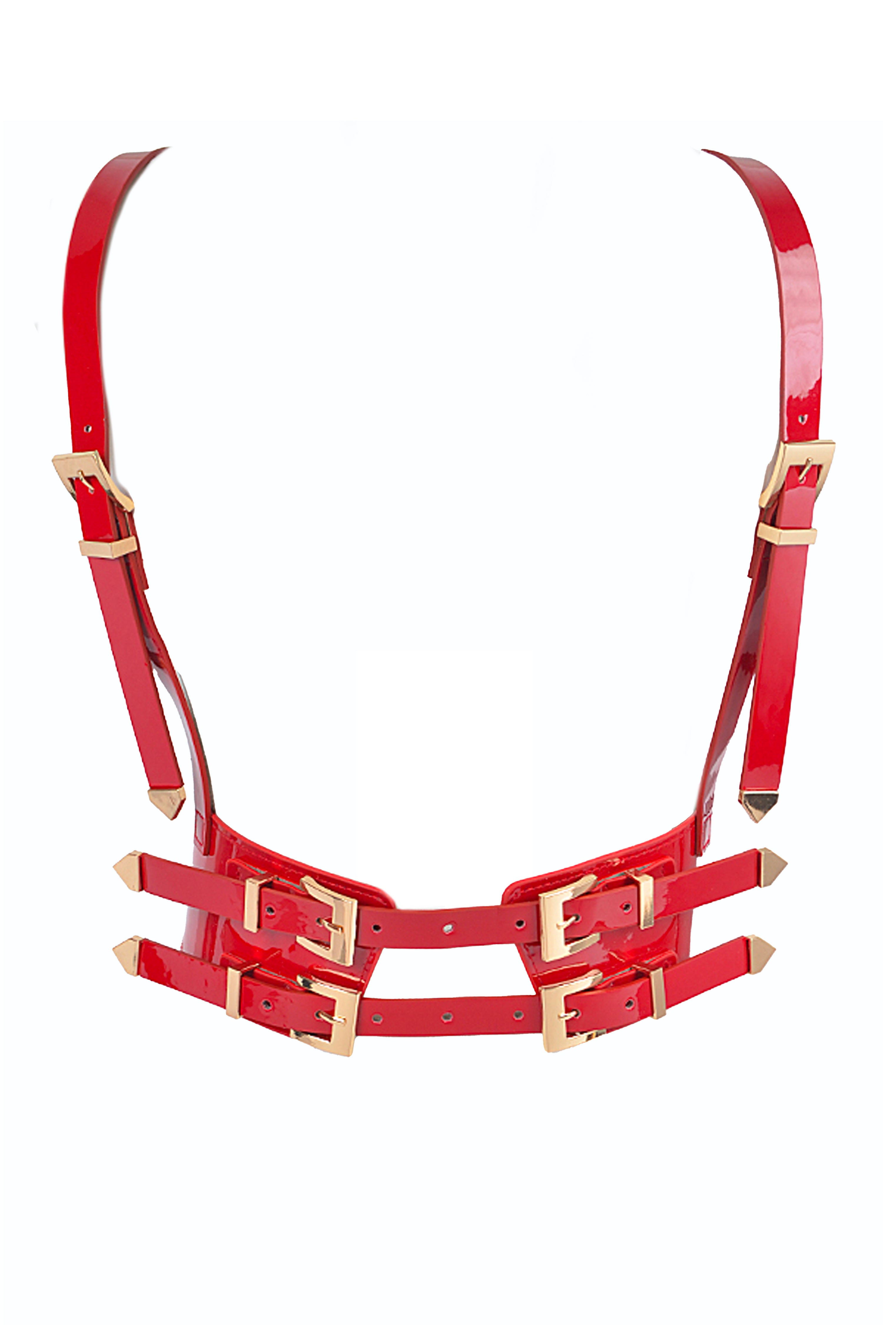 Shiny red patent leather harness with adjustable straps and gold hardware